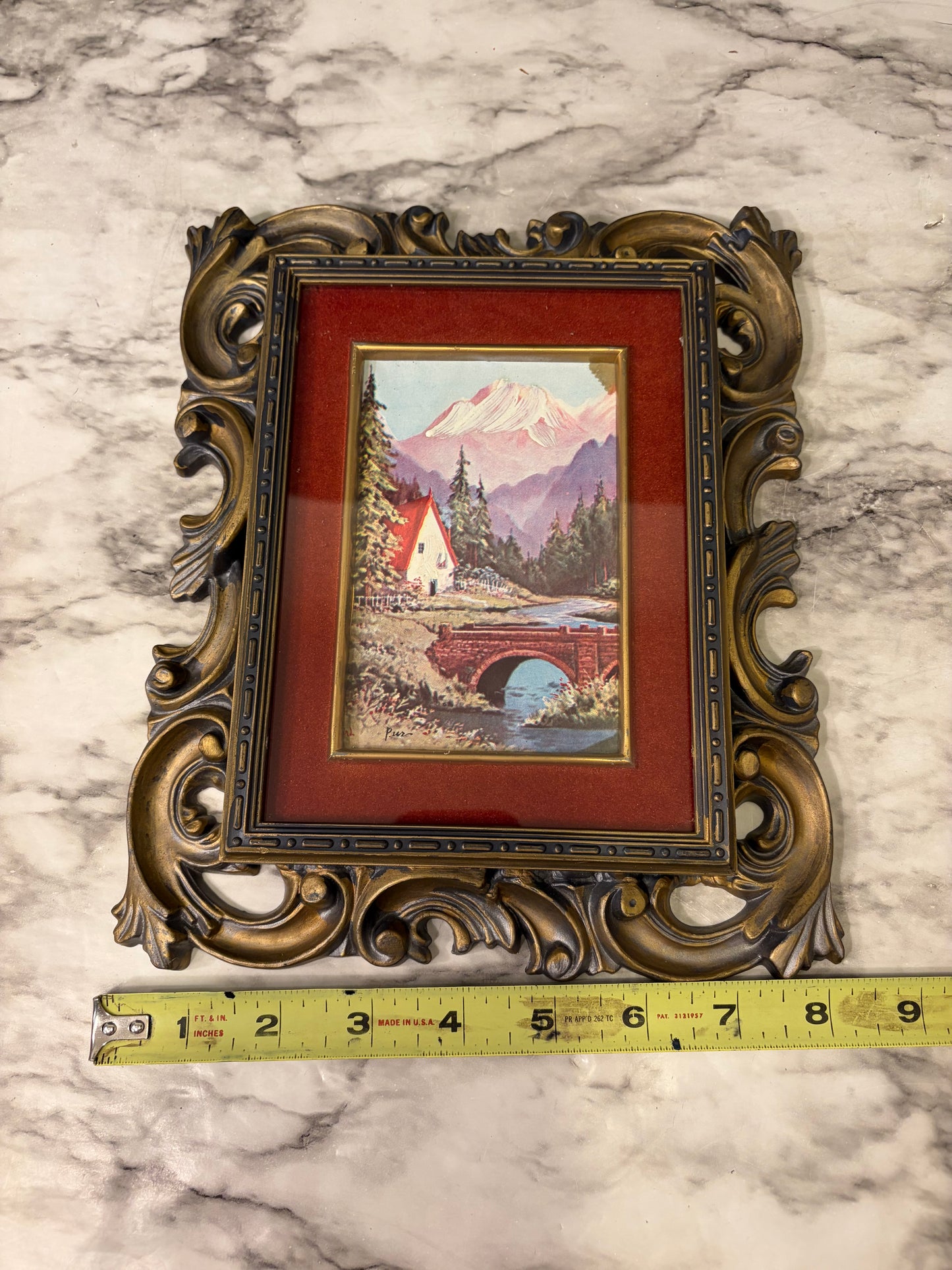 Black and Gold Molded Frame of Bridge