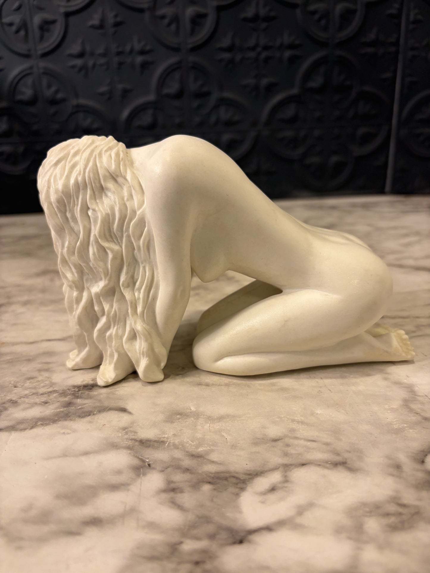 Nude Woman Bent over Statue