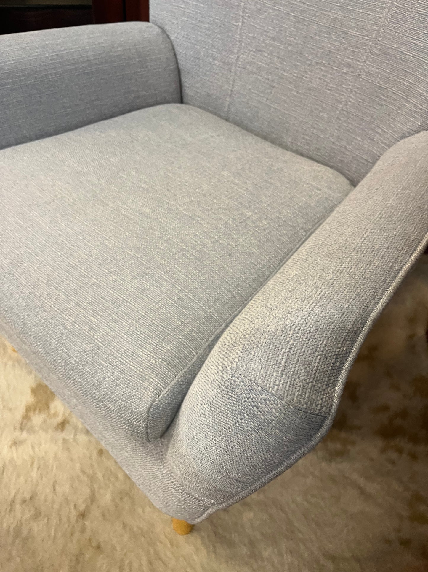 Gray arm chair with modern silhouette