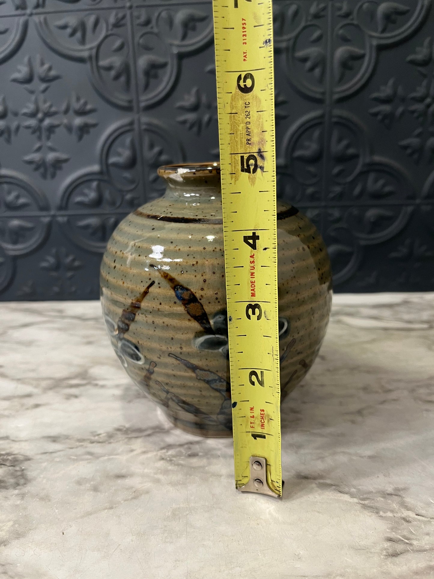 Small Ribbed Pottery Vase with Flowers