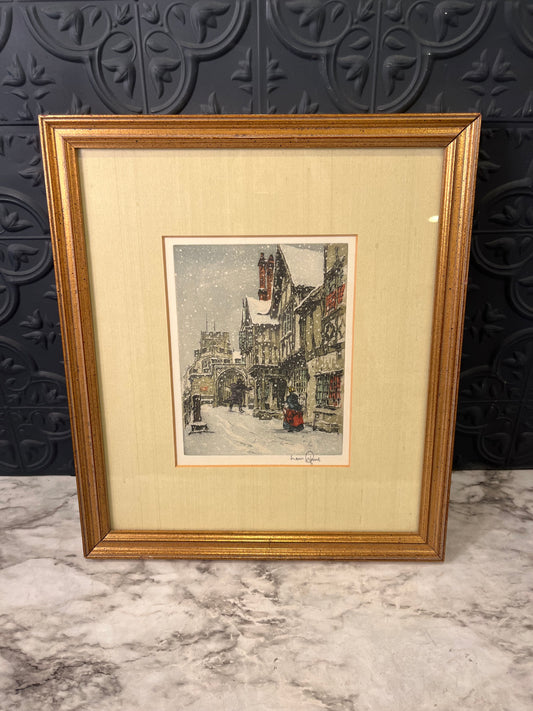 Snowy European street framed print