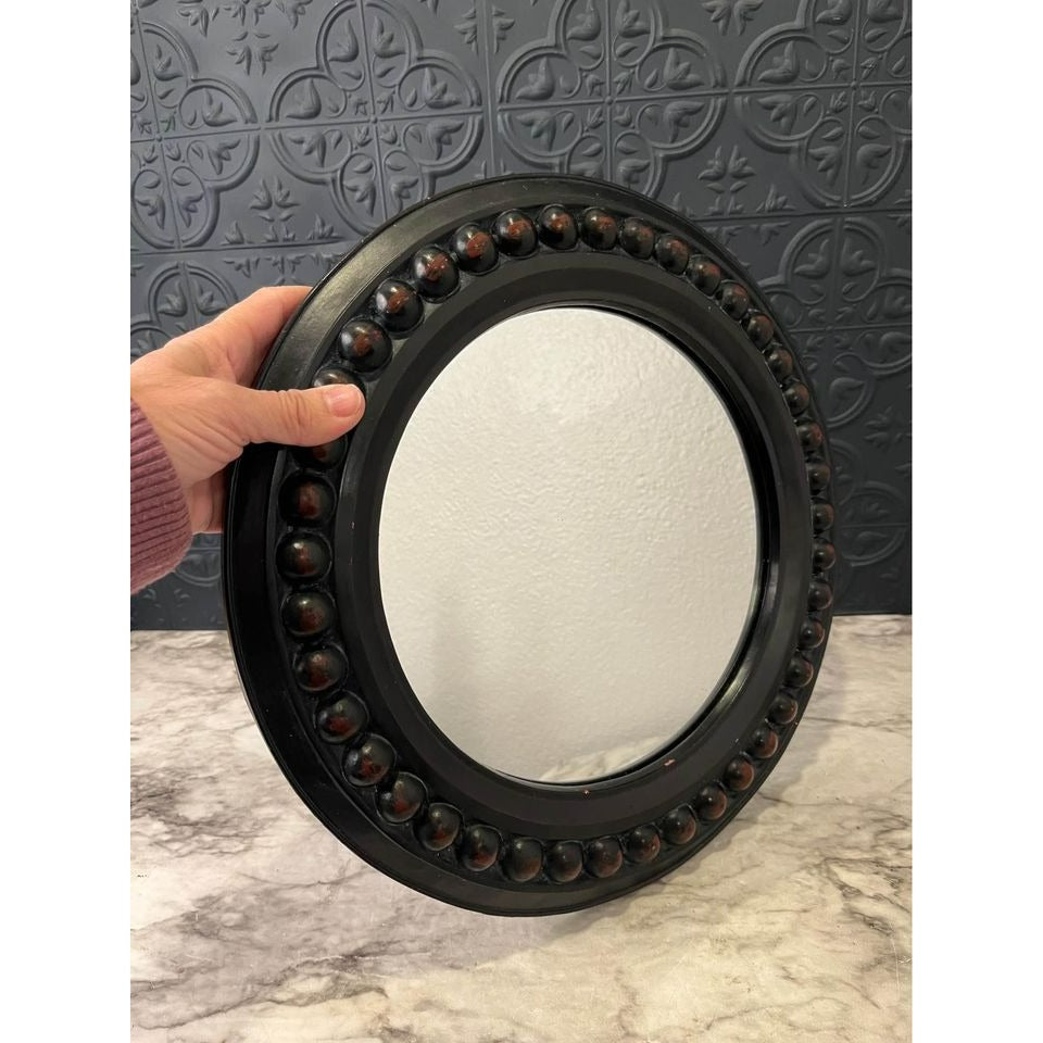 Round dark wood mirror