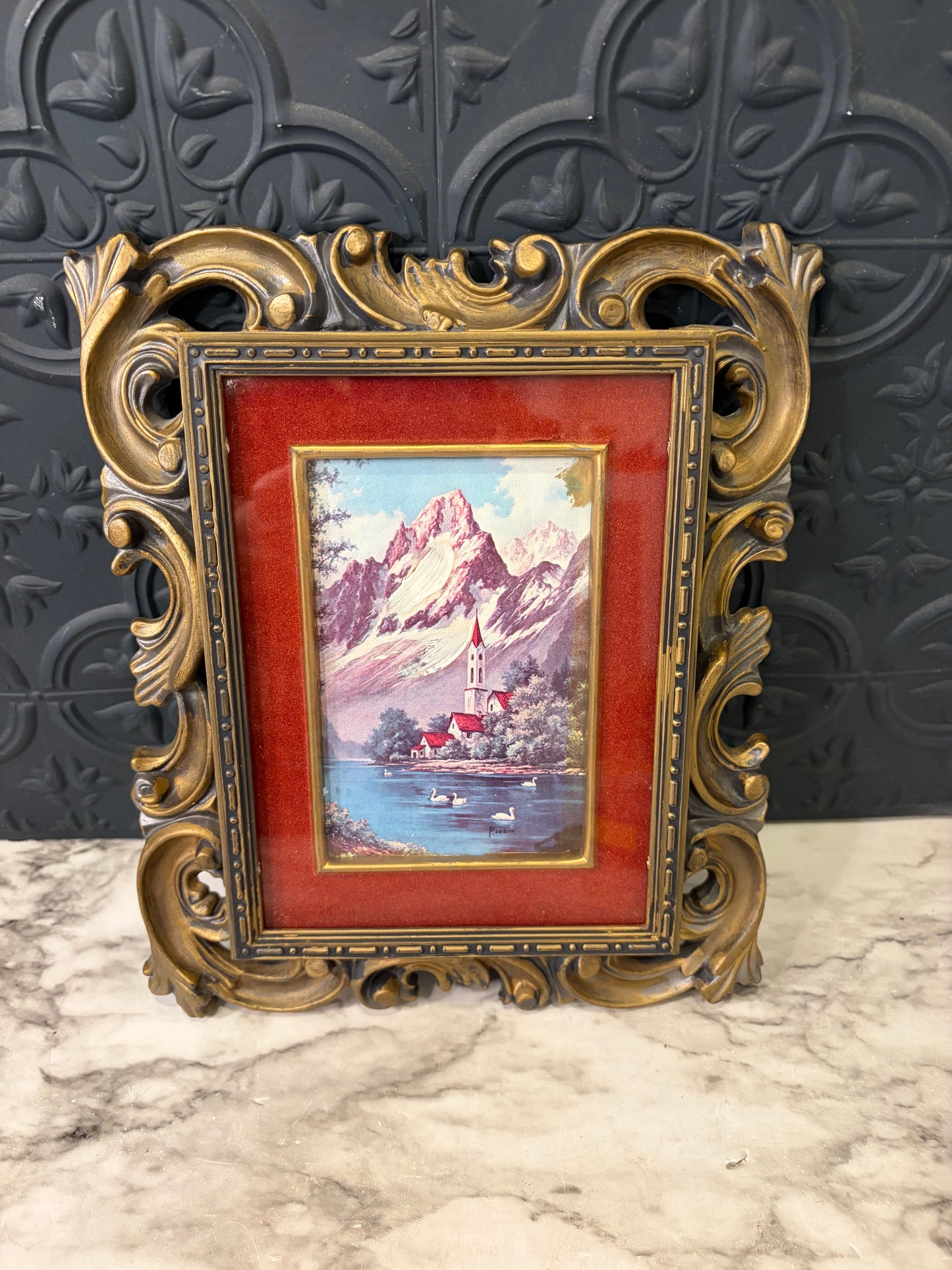 Black and Gold Molded Frame of Snow Covered Mountain