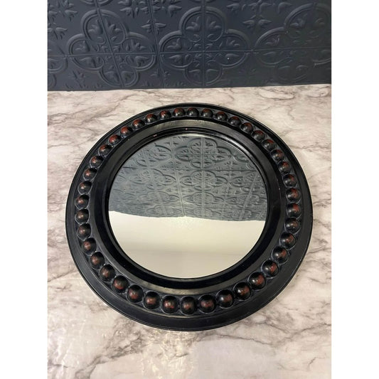 Round dark wood mirror