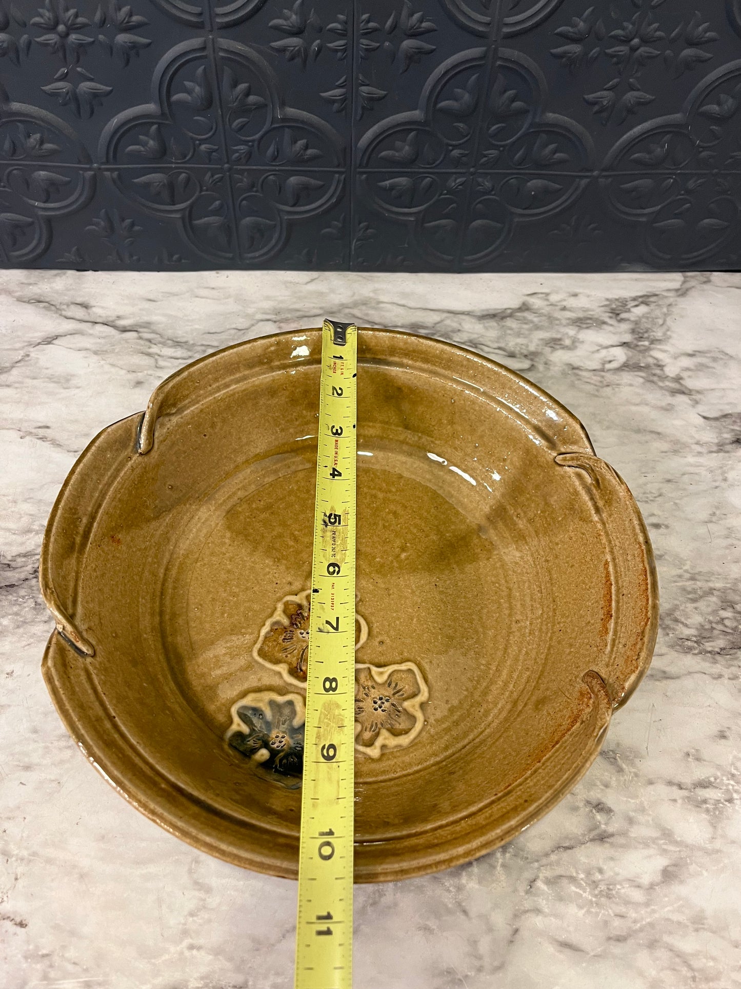 Pottery bowl with three flowers