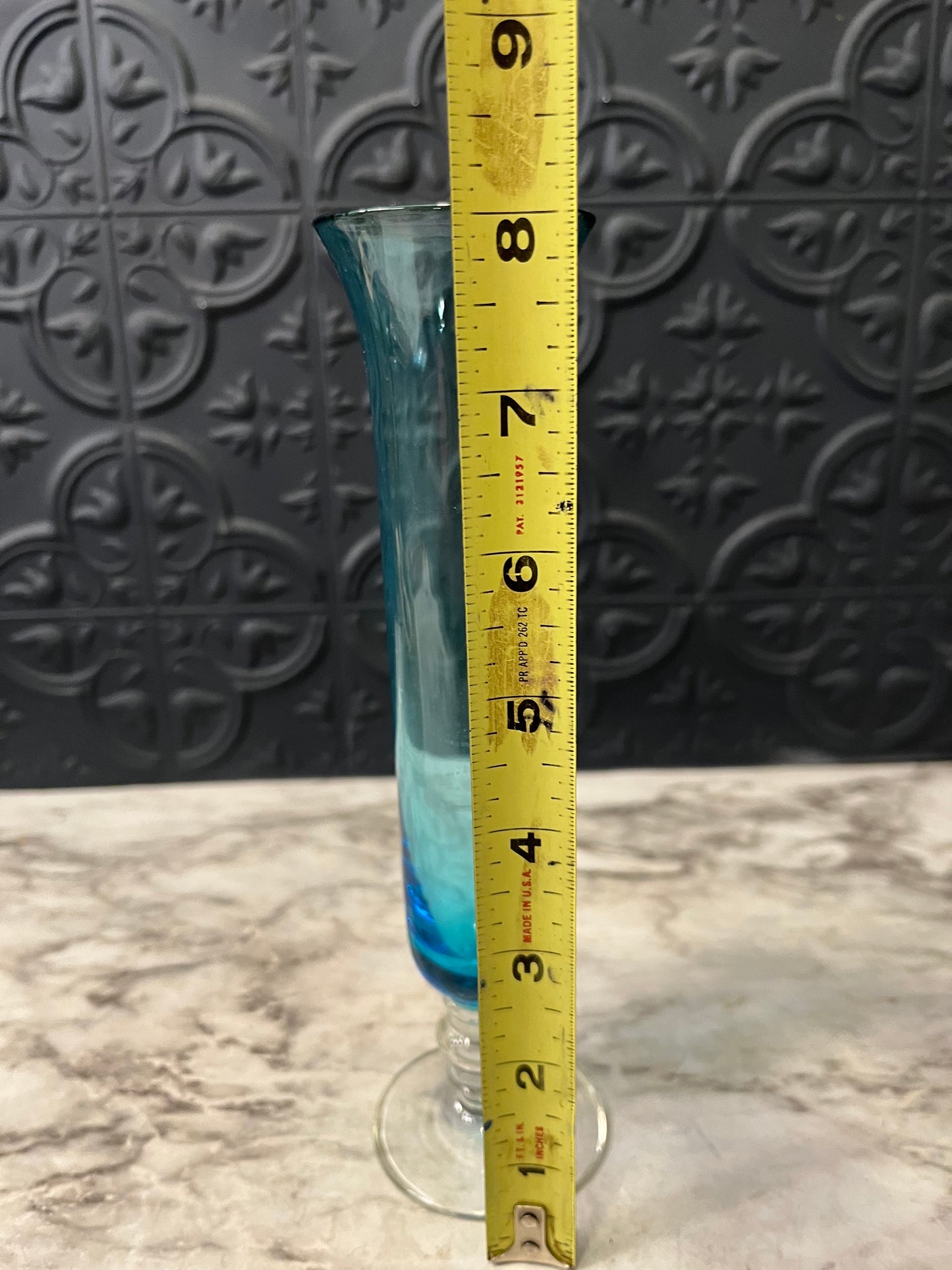 Blue glass bud vase with clear base