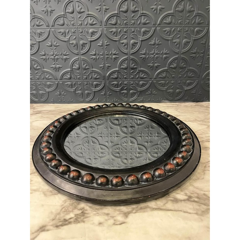 Round dark wood mirror