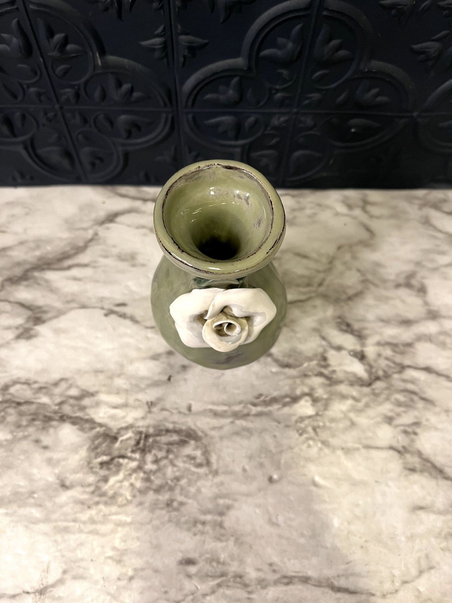 Green Pottery Vase With White Rose