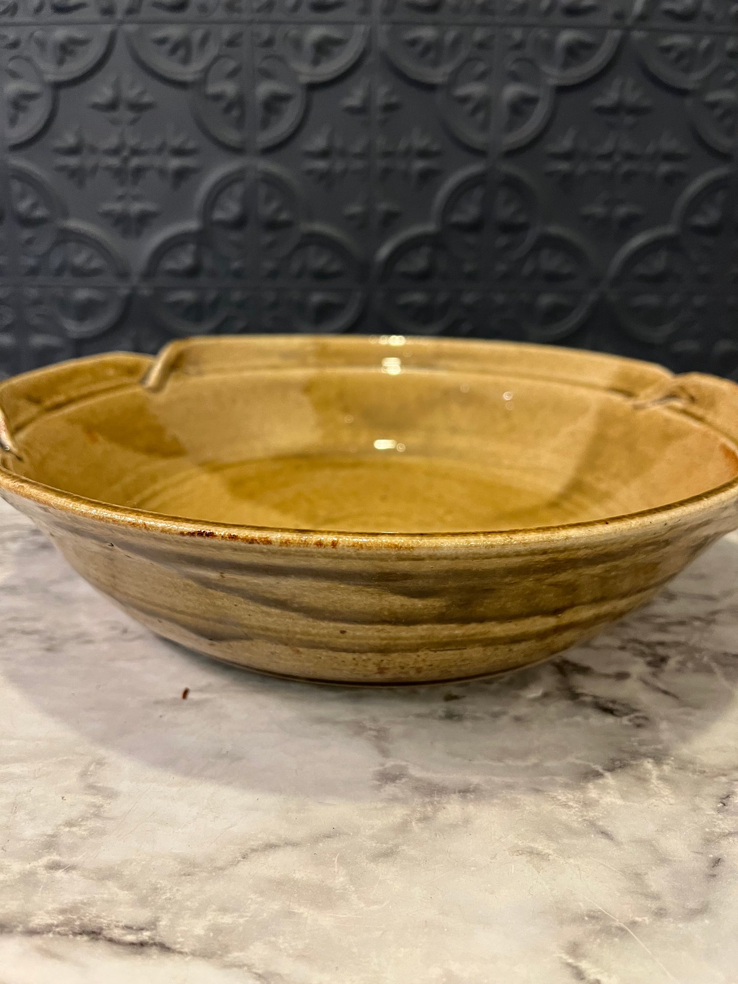 Pottery bowl with three flowers
