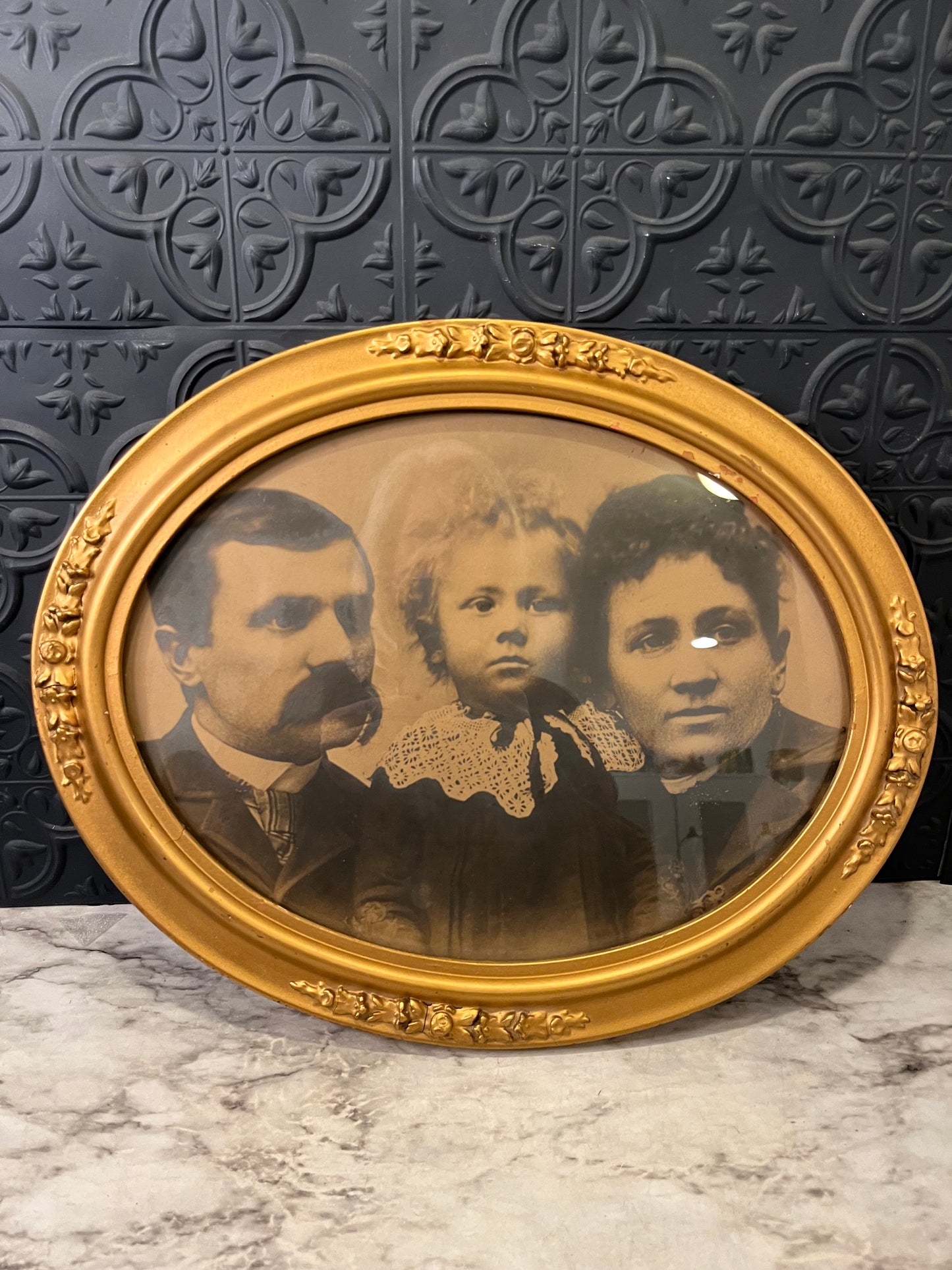 Antique Family Portrait in Oval Gold Frame