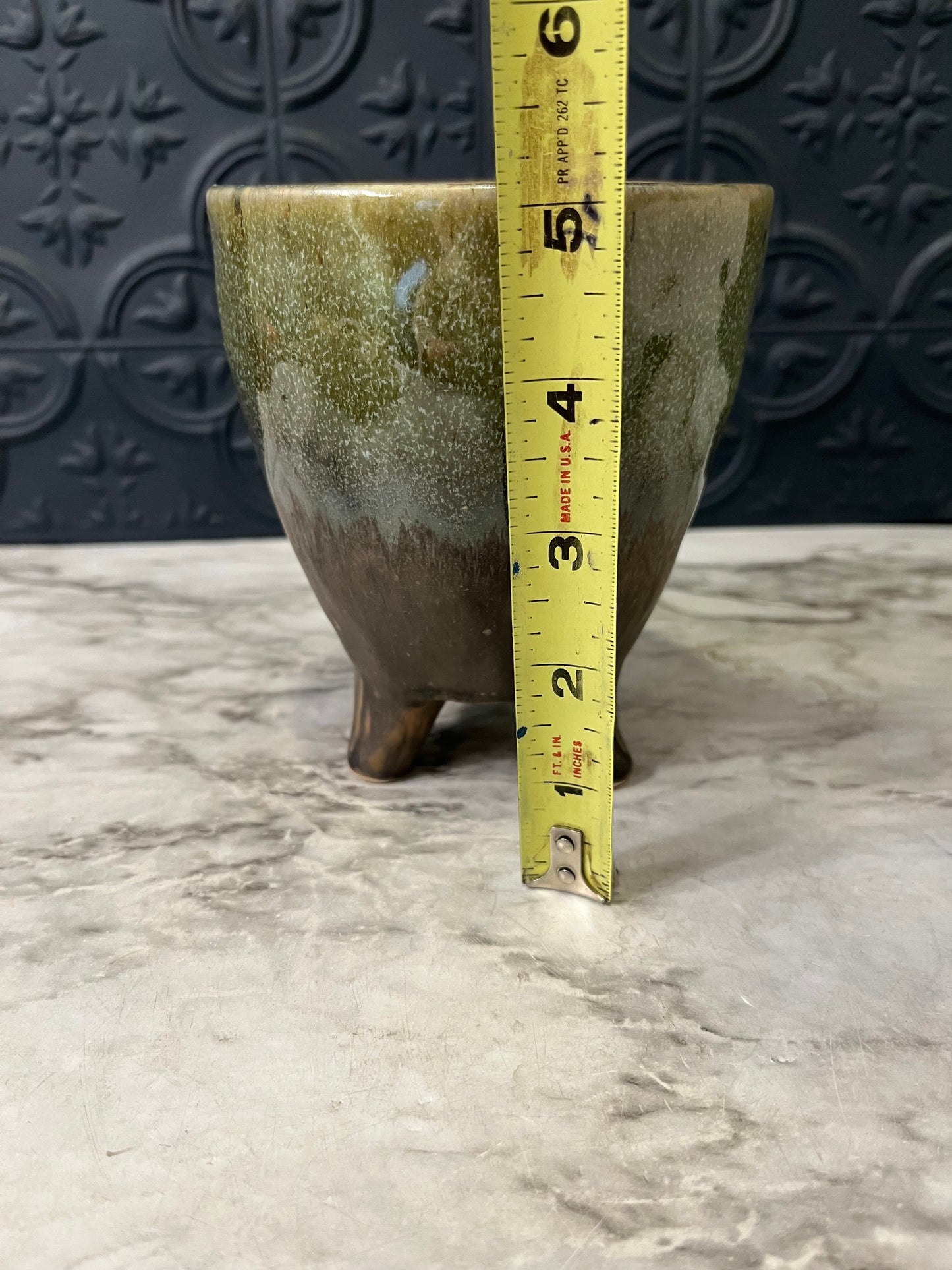 Green and Brown planter with 3 feet