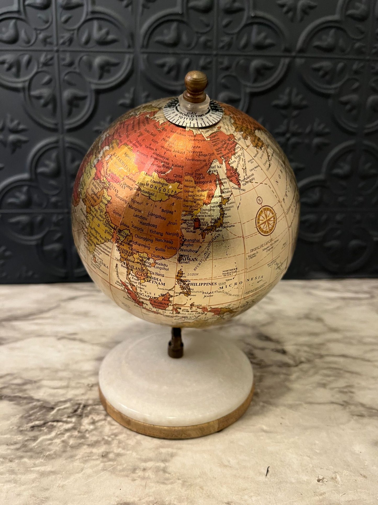 Small Metallic Globe on white  base