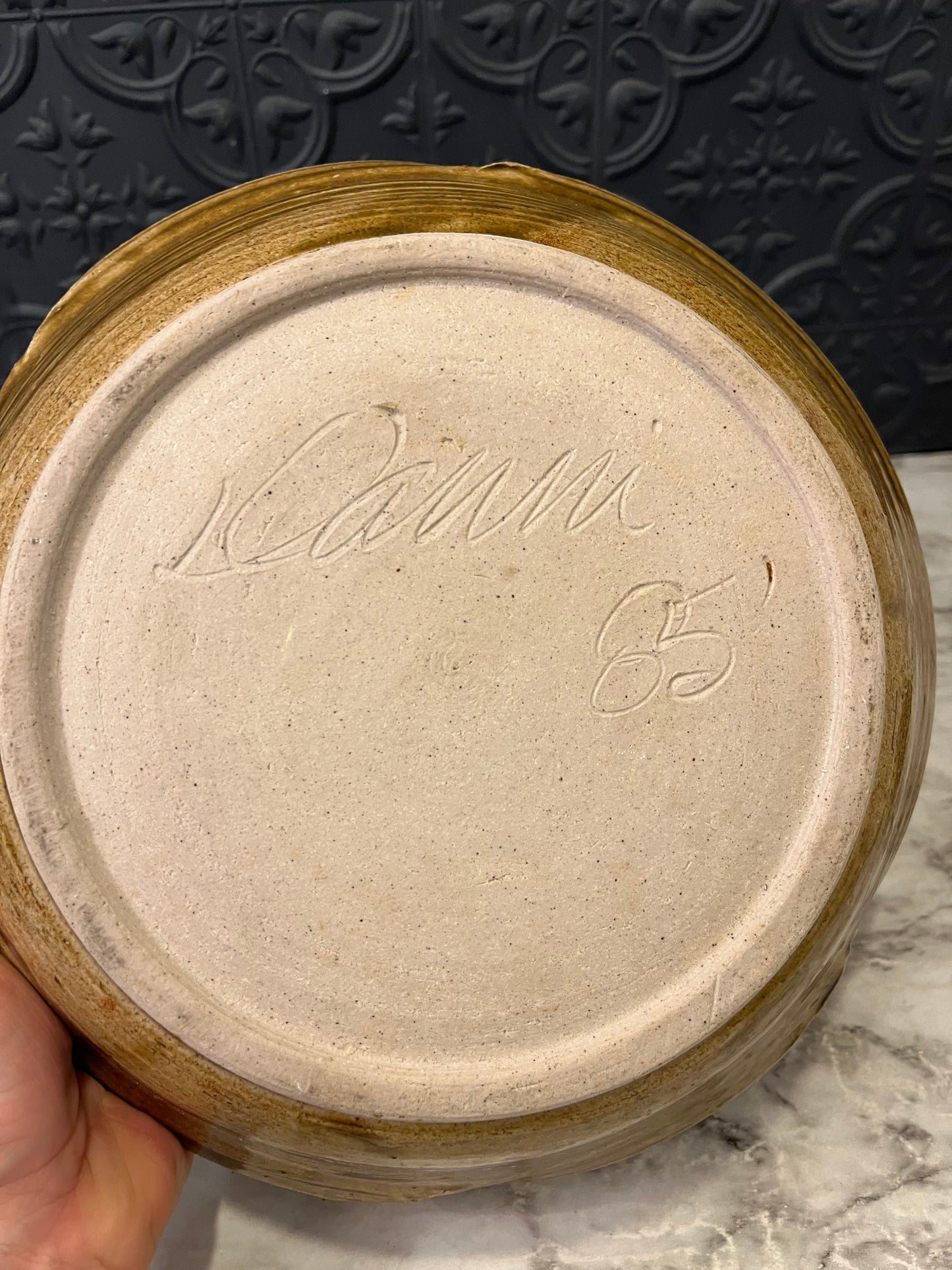 Pottery bowl with three flowers