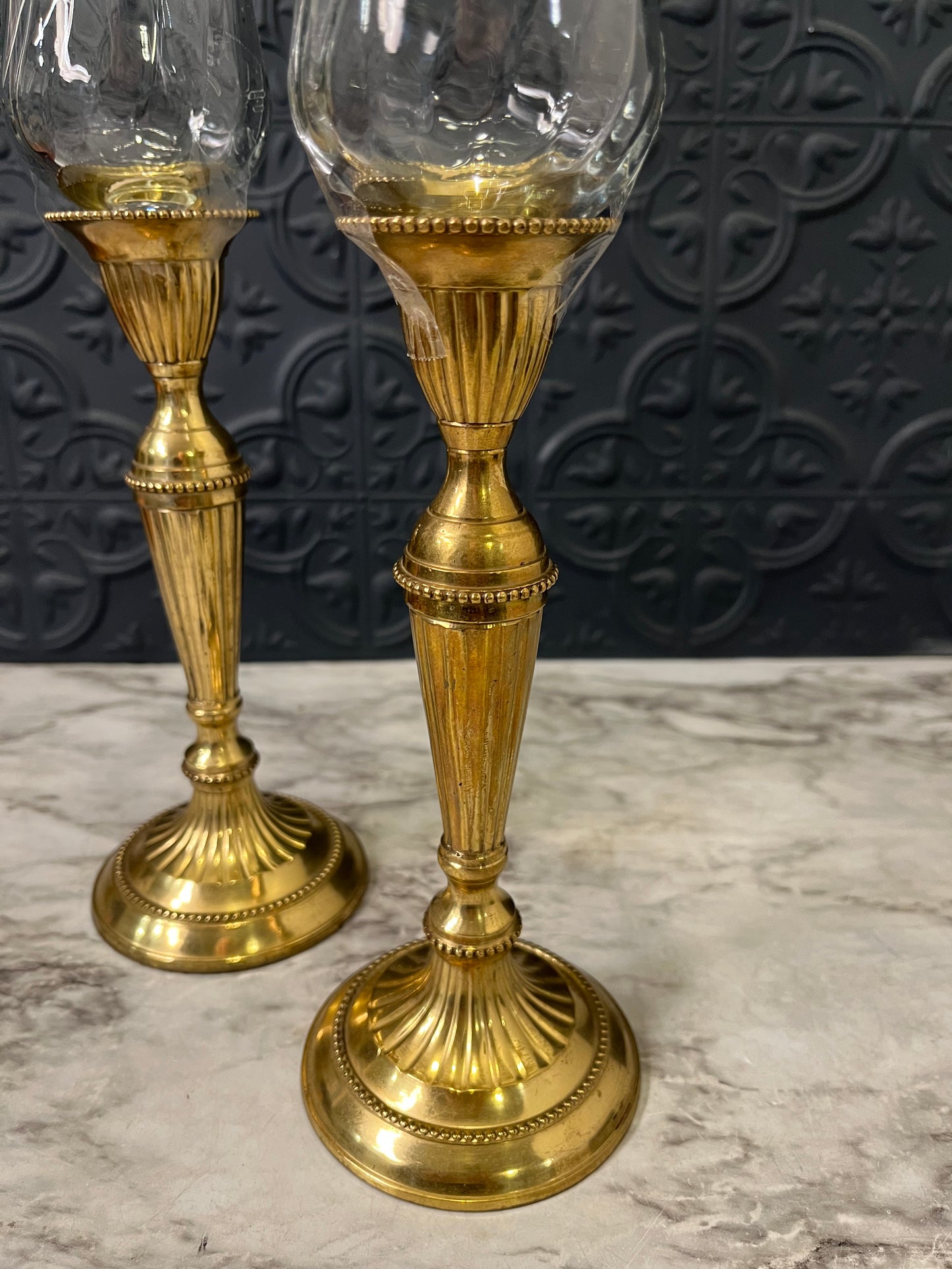 Brass candle holders with clear votive holders