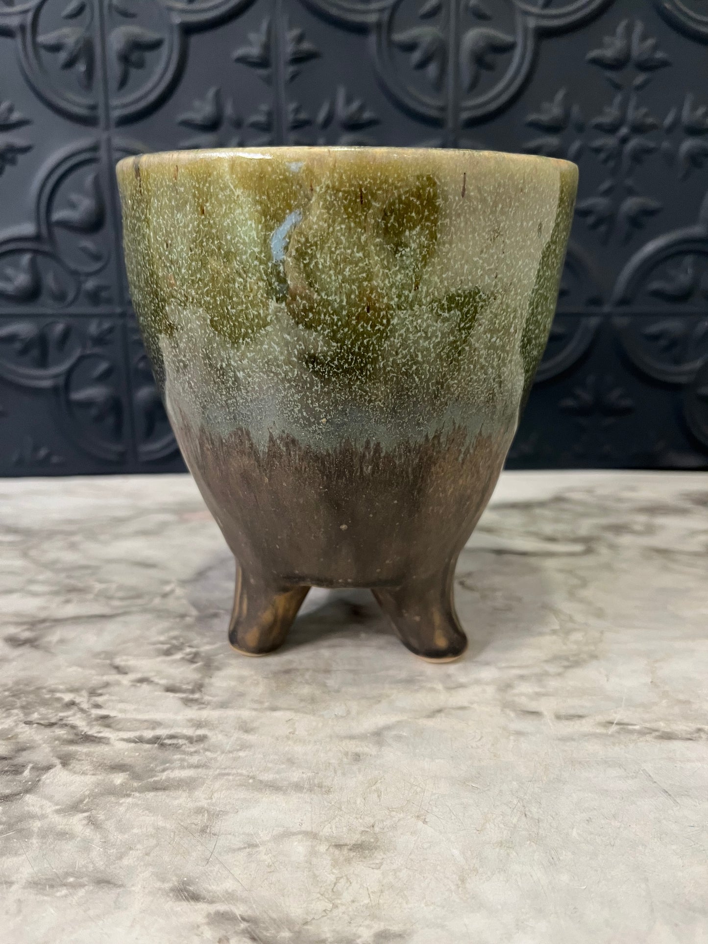 Green and Brown planter with 3 feet