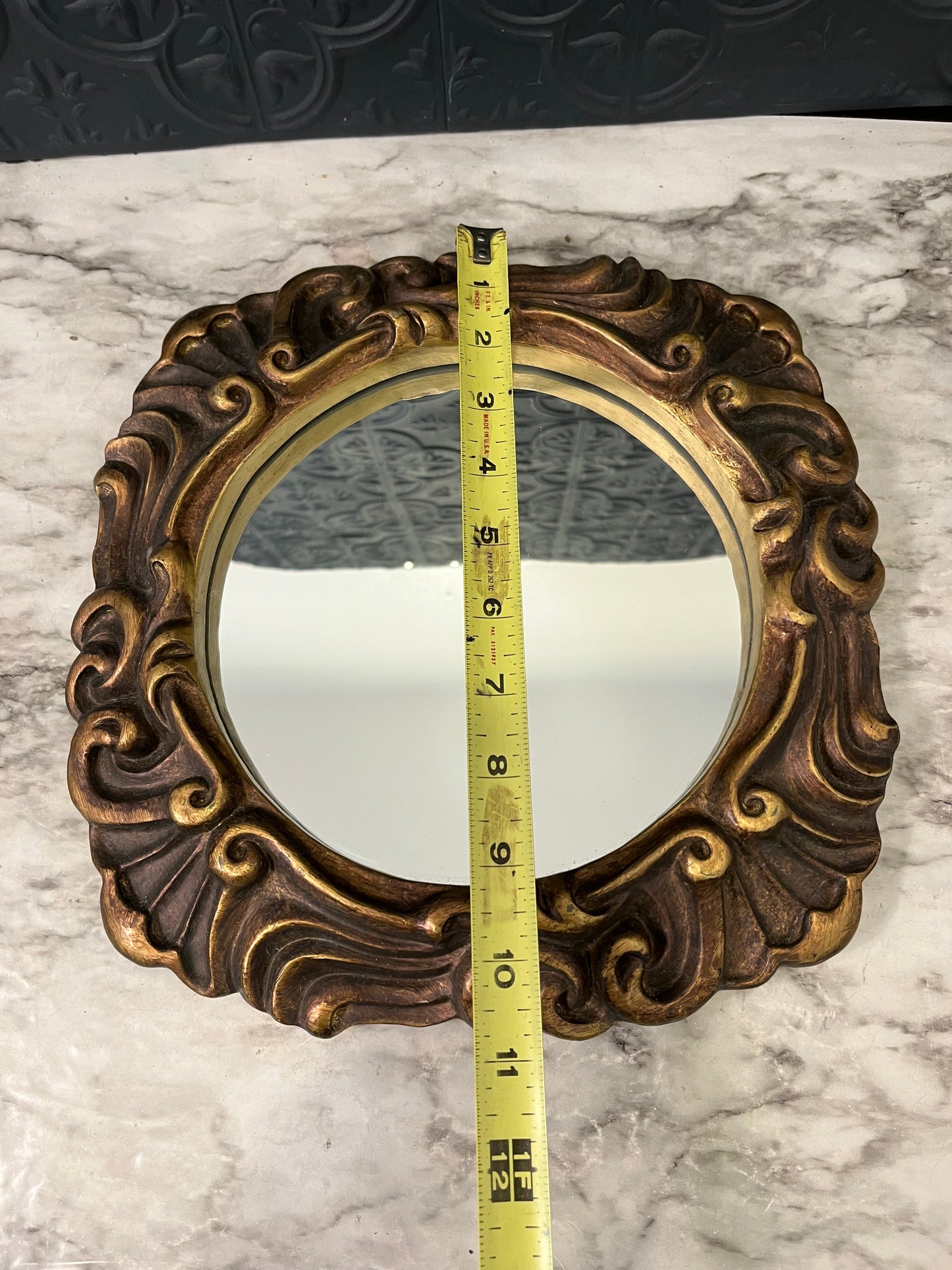 Ornate round mirror with resin frame 11"