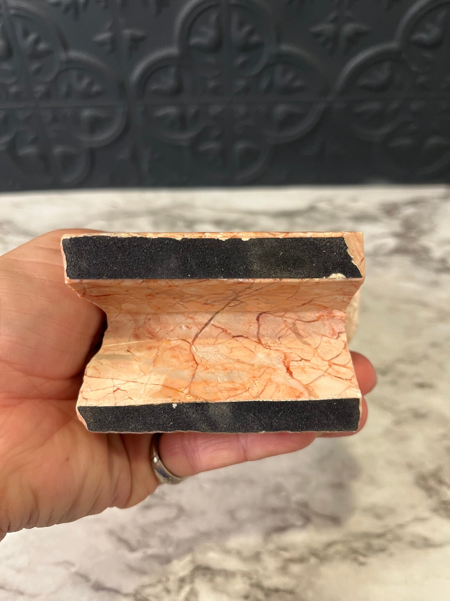 Carved pink stone bird