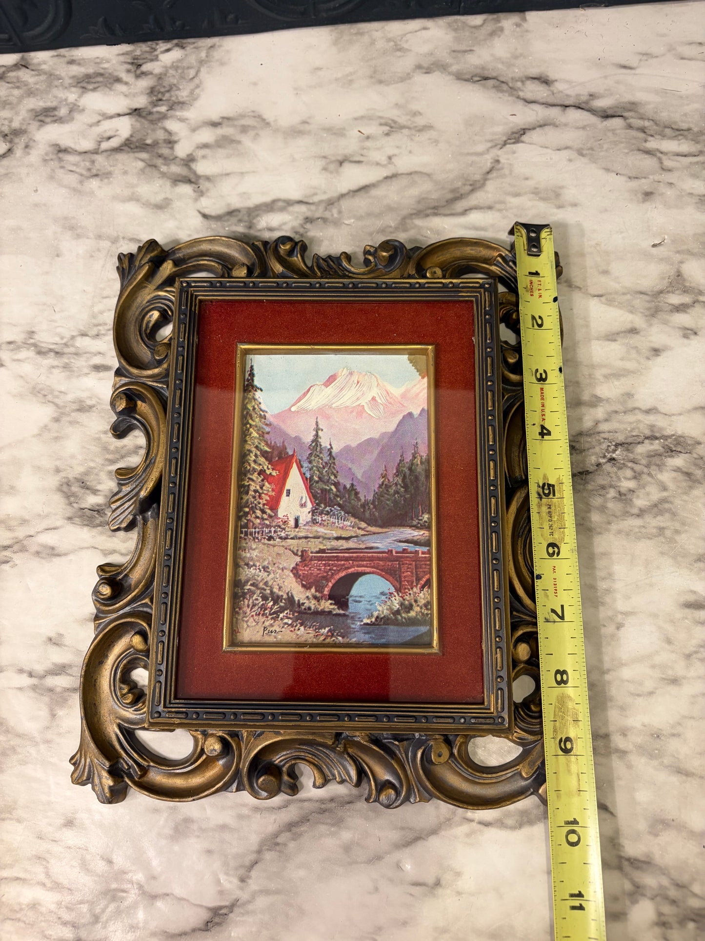 Black and Gold Molded Frame of Bridge