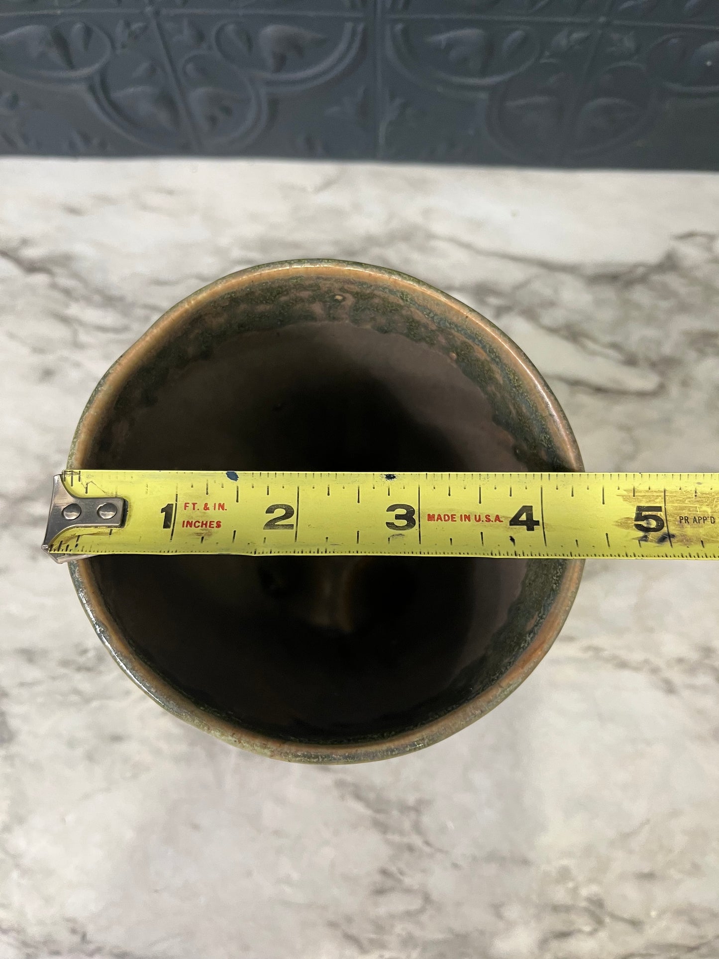 Green and Brown planter with 3 feet