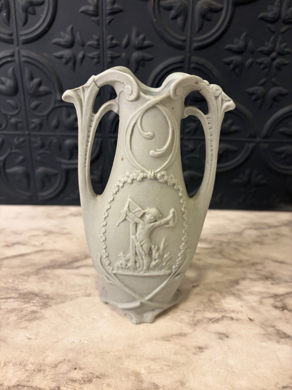 Double Handle Bisque Porcelain Vase with Cherubs
