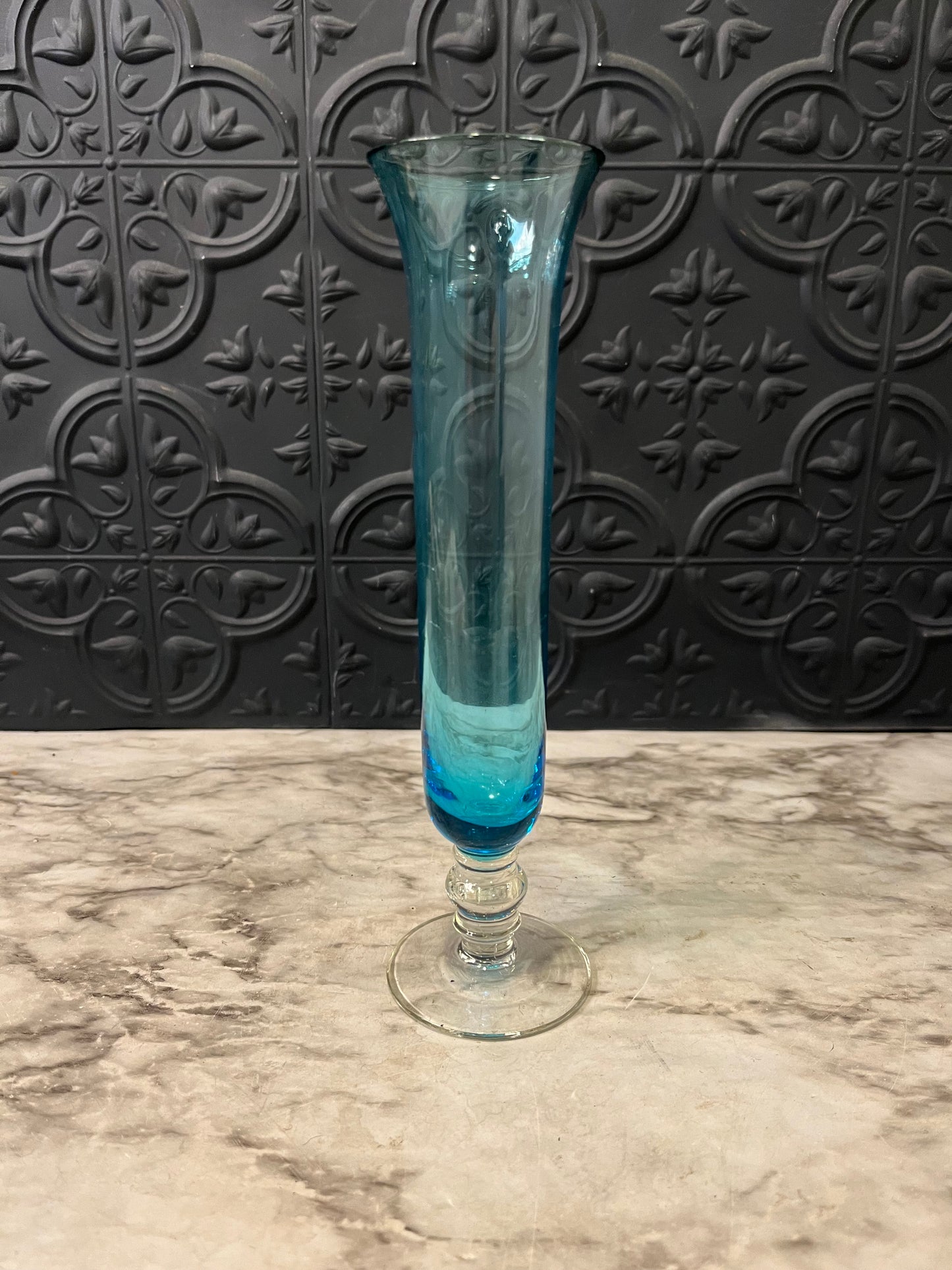 Blue glass bud vase with clear base