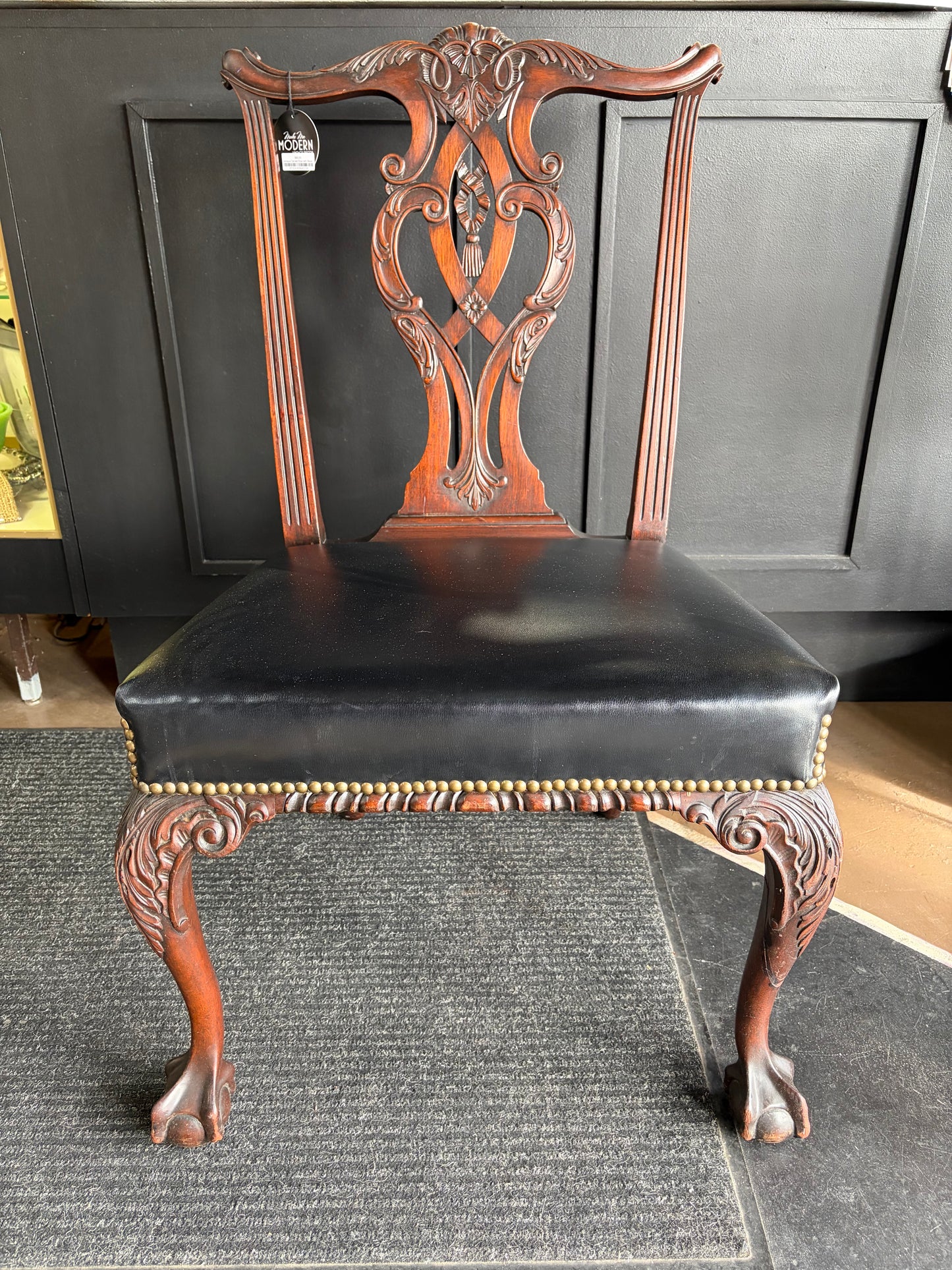Antique Carved Chair with Black Seat