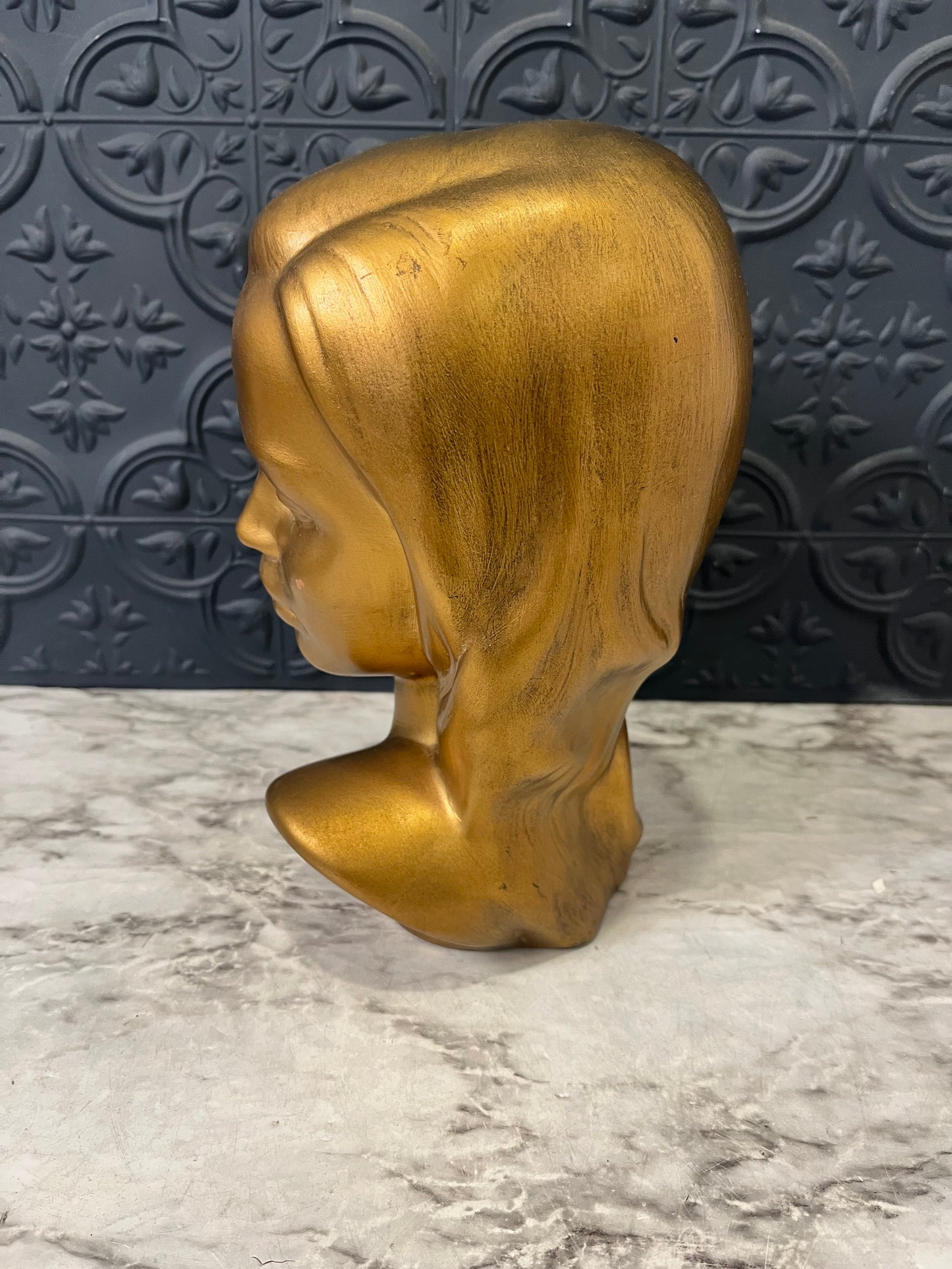 Gold Bust of Woman with Flower in Hair