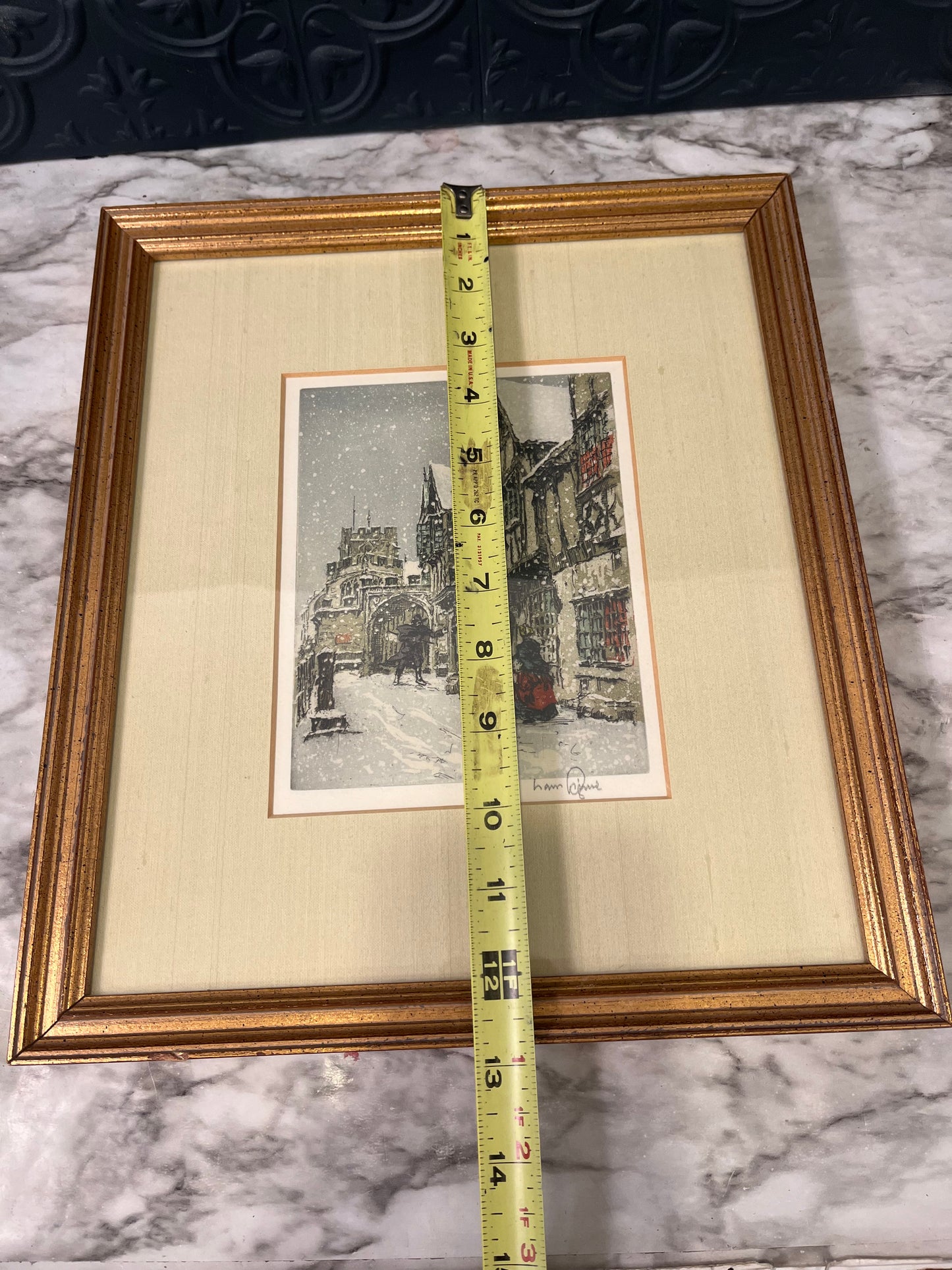 Snowy European street framed print