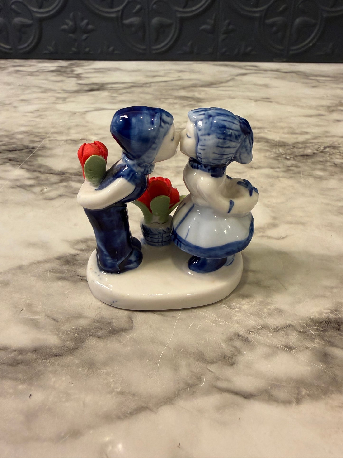 Delft Boy and Girl Kissing with flower