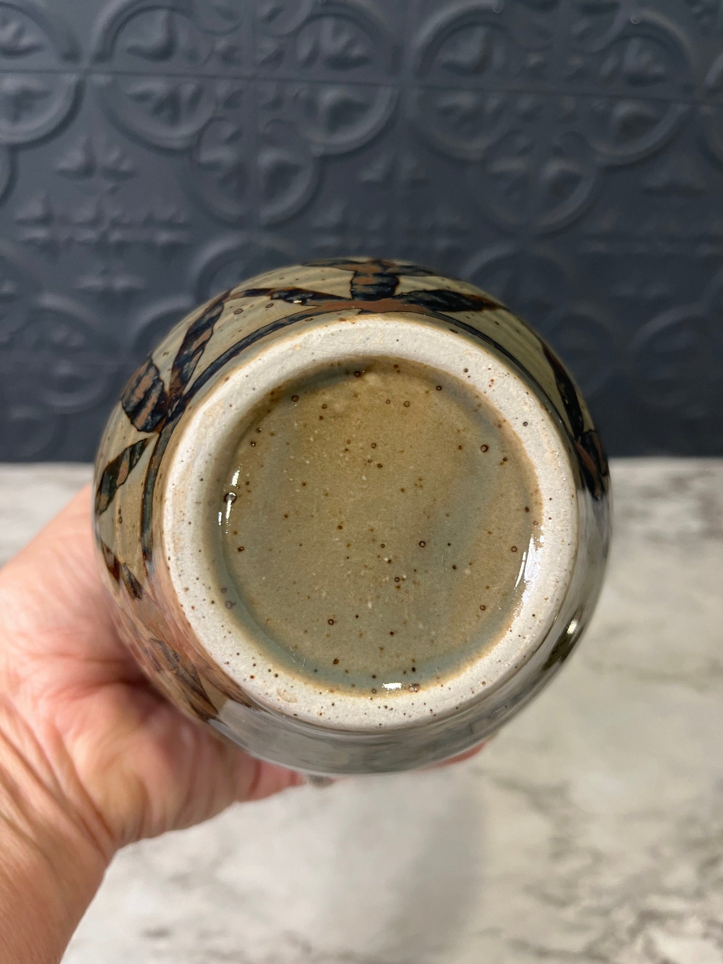 Small Ribbed Pottery Vase with Flowers