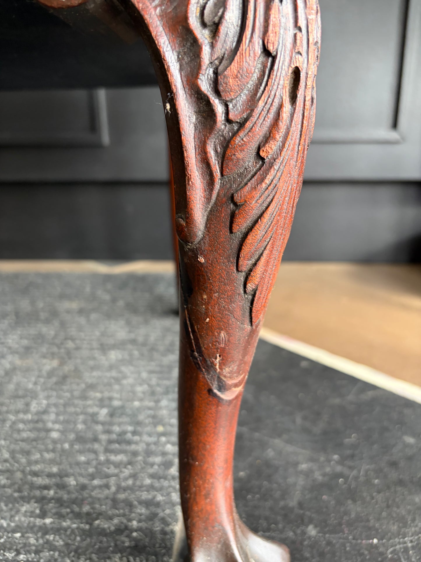 Antique Carved Chair with Black Seat