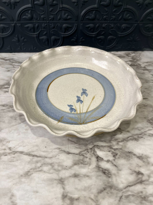 Ruffled pottery plate with floral detail