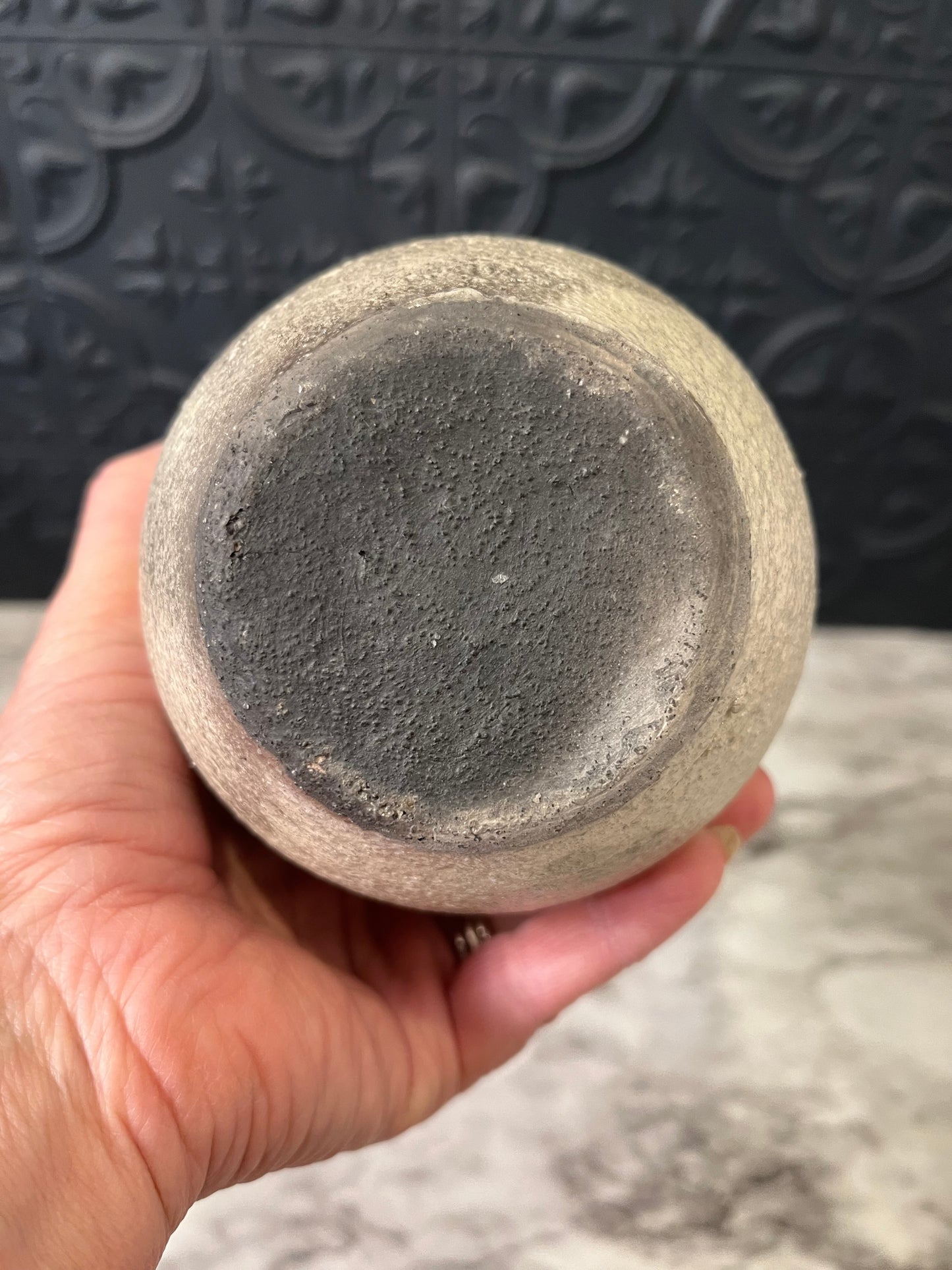 Pottery vase with leaf design around top
