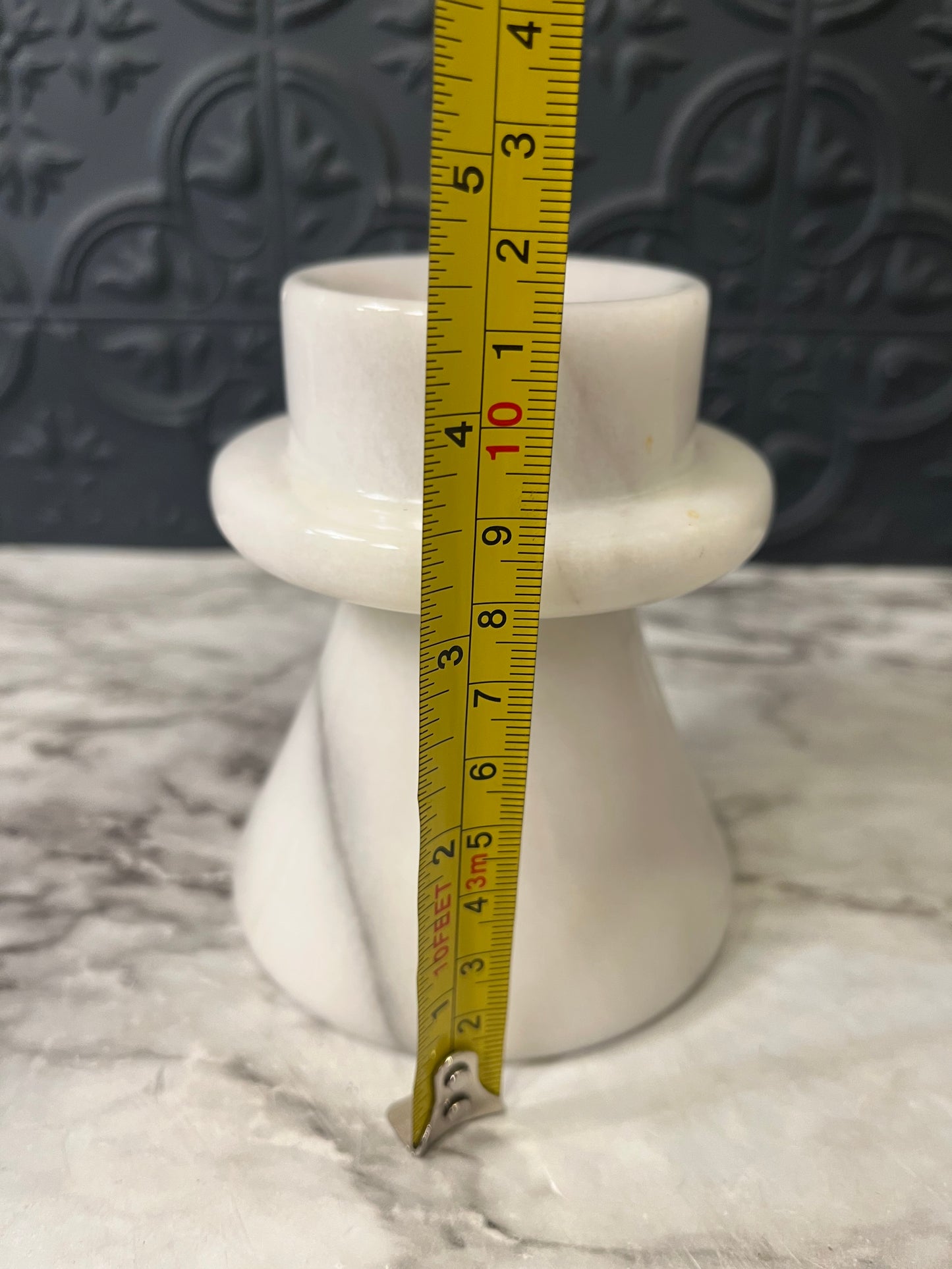 White marble candle holder flared base