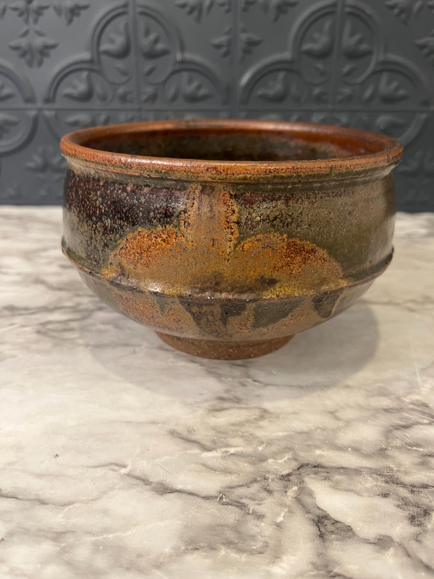Brown Pottery Bowl with Leaf