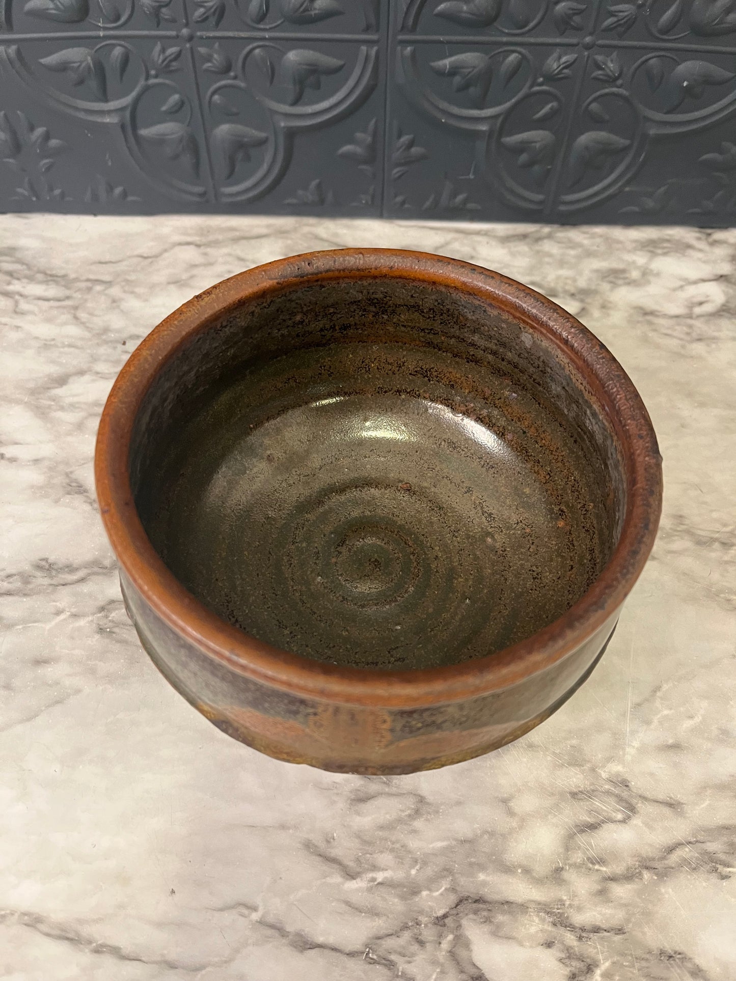 Brown Pottery Bowl with Leaf