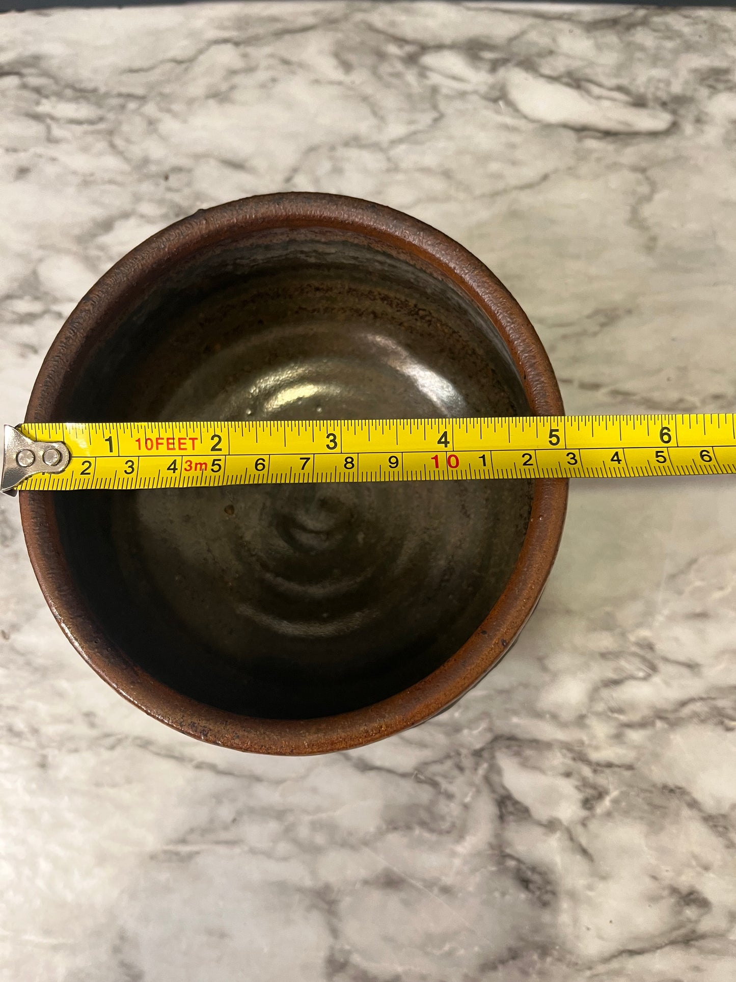 Brown Pottery Bowl with Leaf