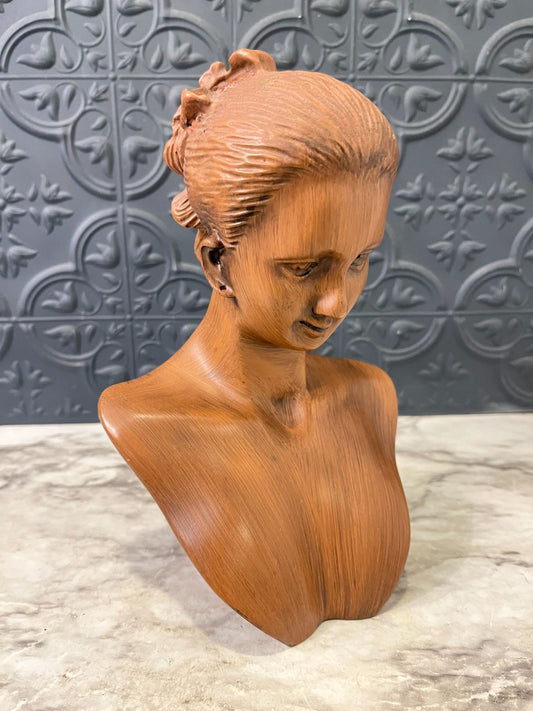 Brown bust of woman