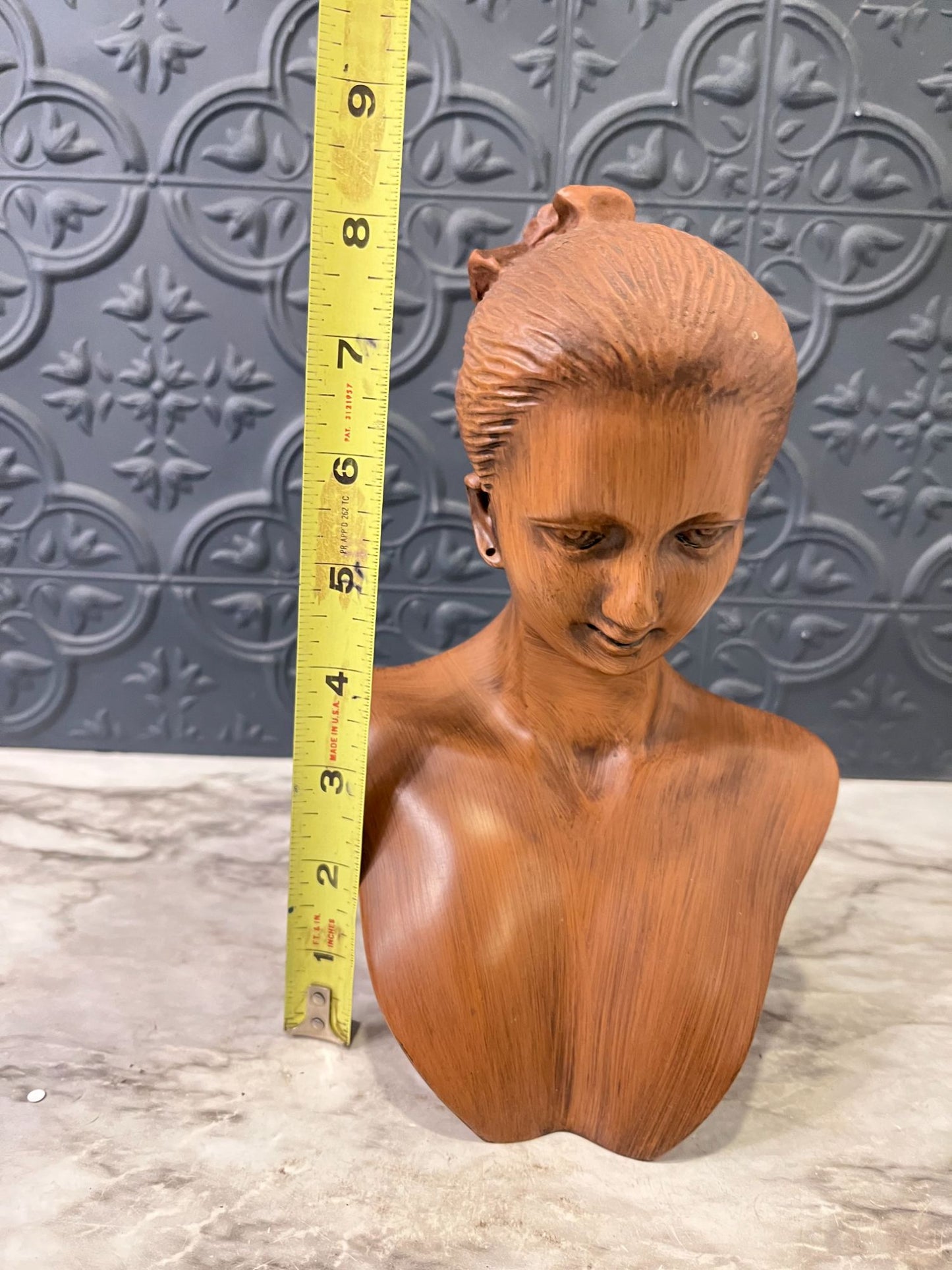 Brown bust of woman