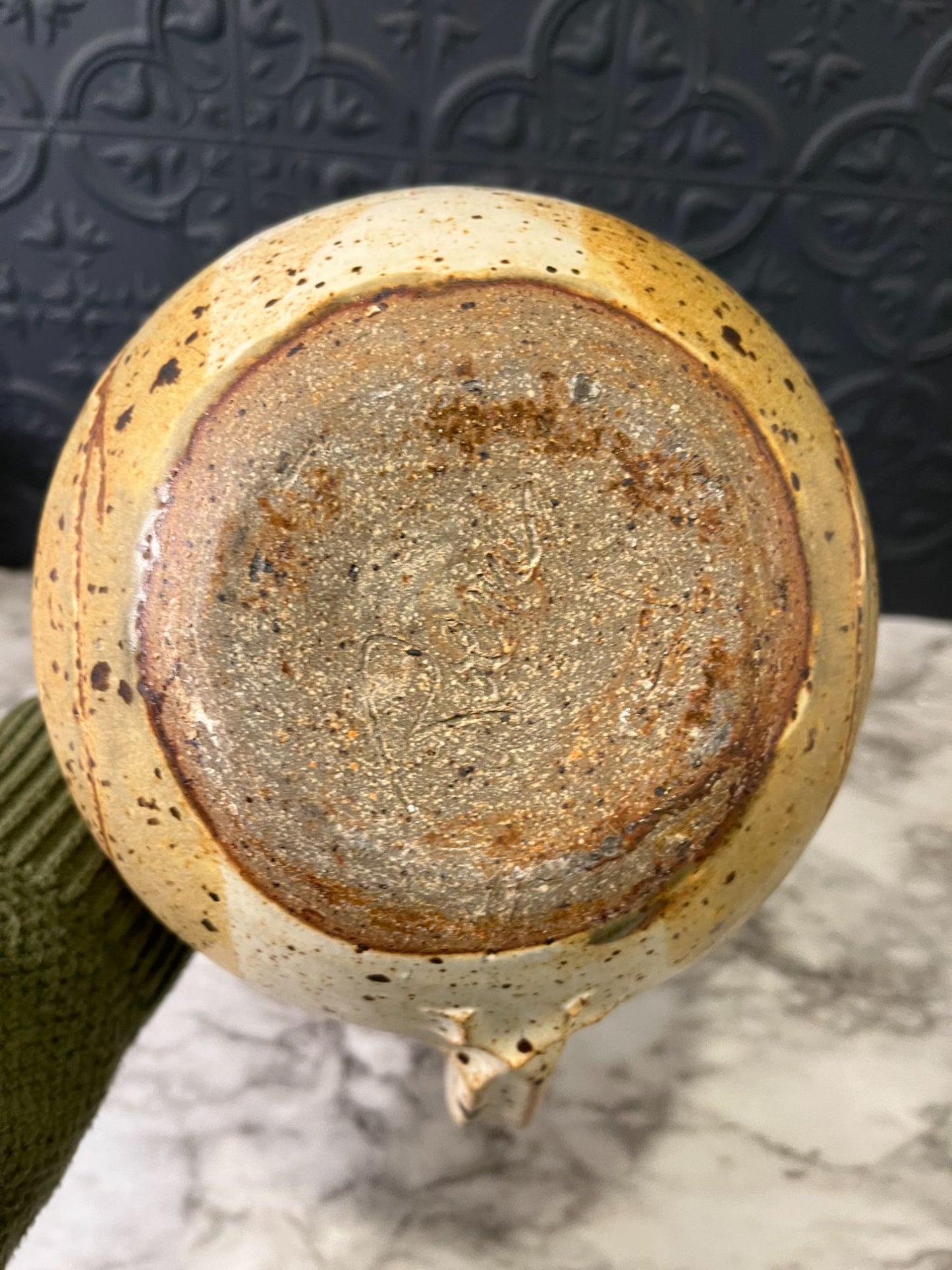 Round pottery pitcher with spots