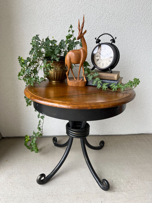 Black metal table with wood top