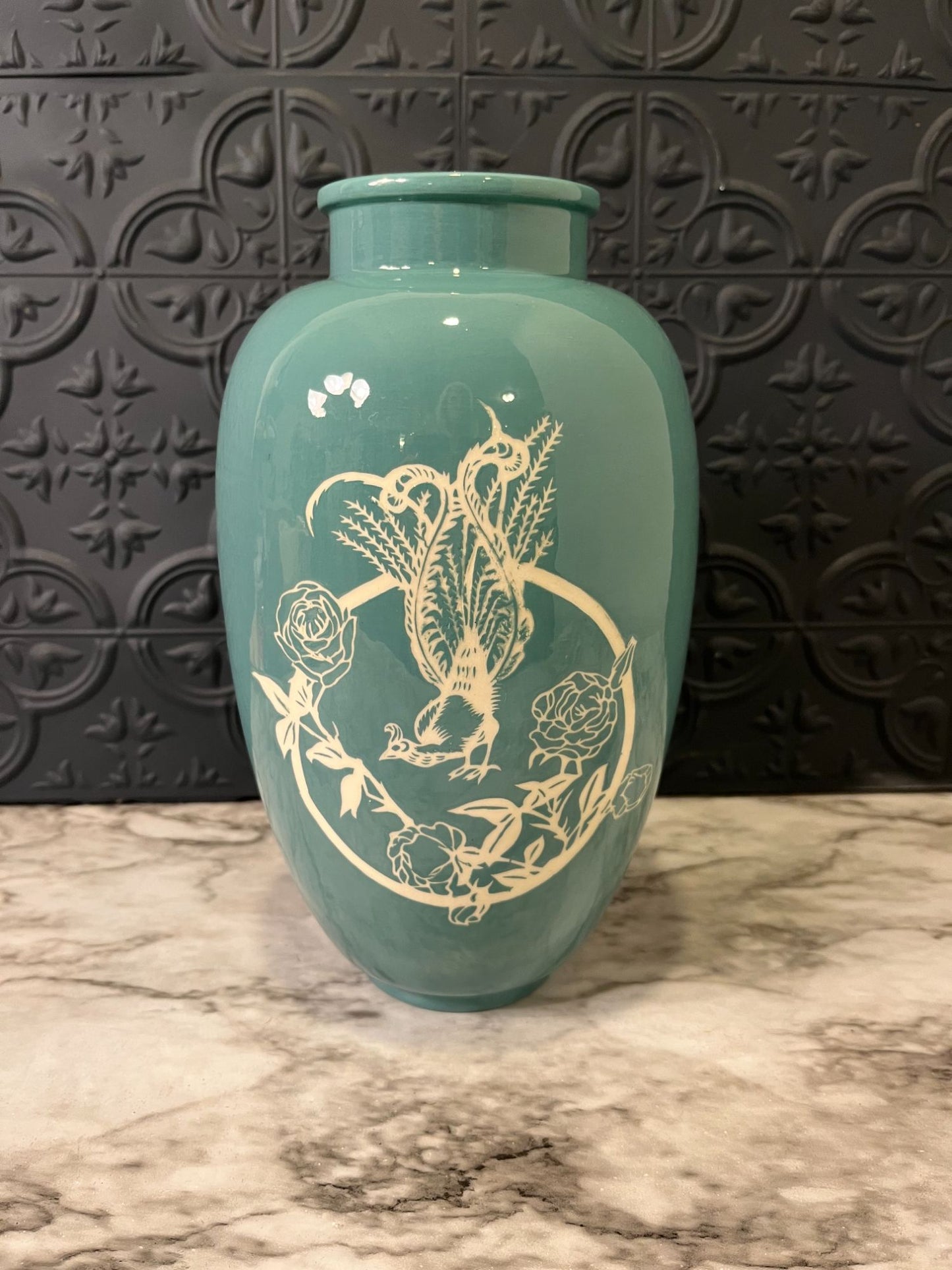 Blue vase with rooster