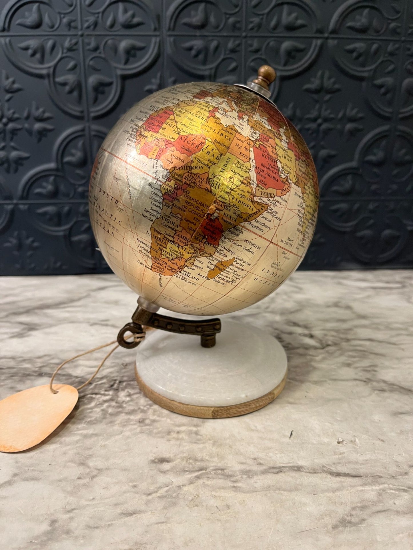 Small Metallic Globe on white  base