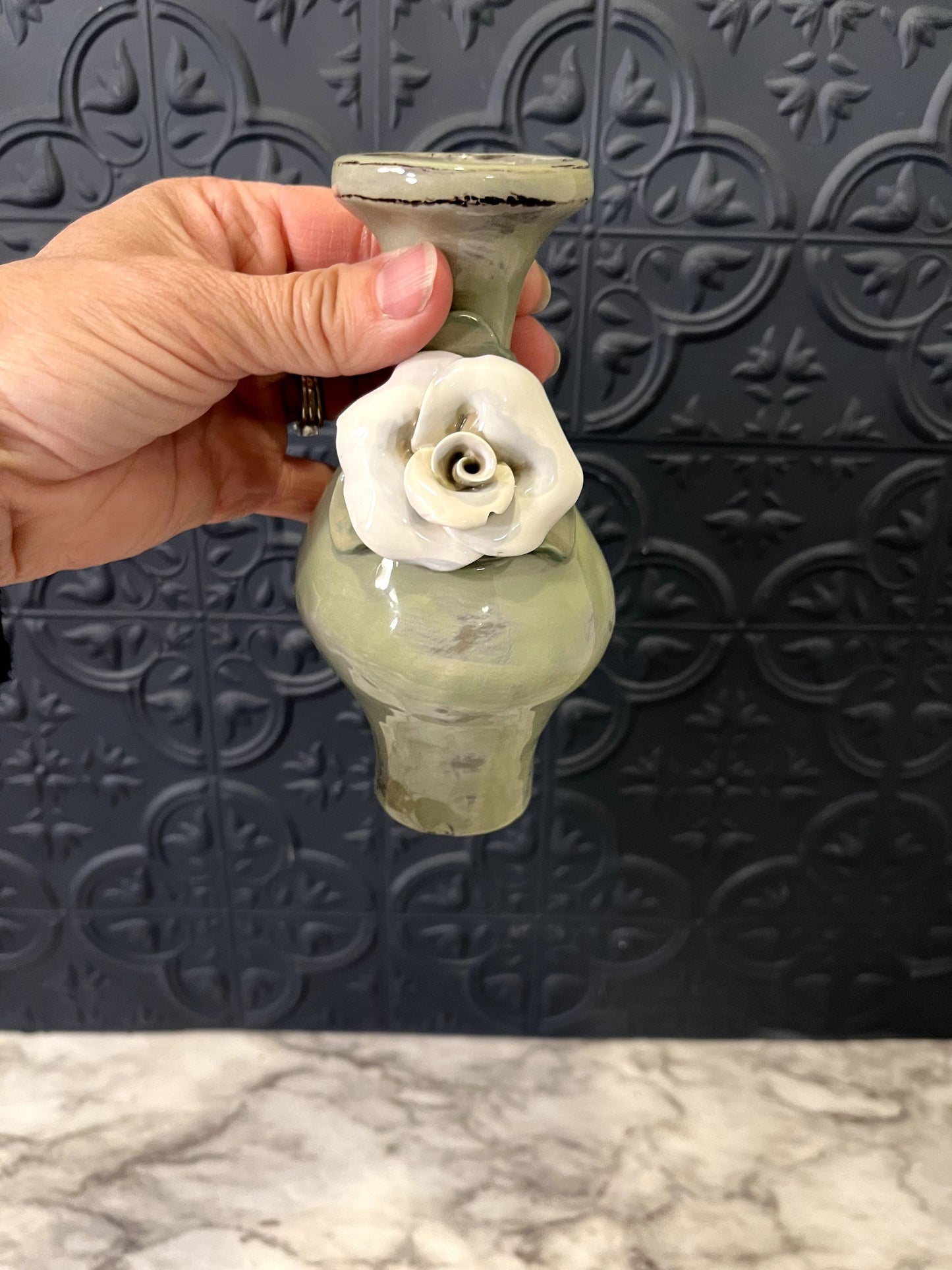 Green Pottery Vase With White Rose