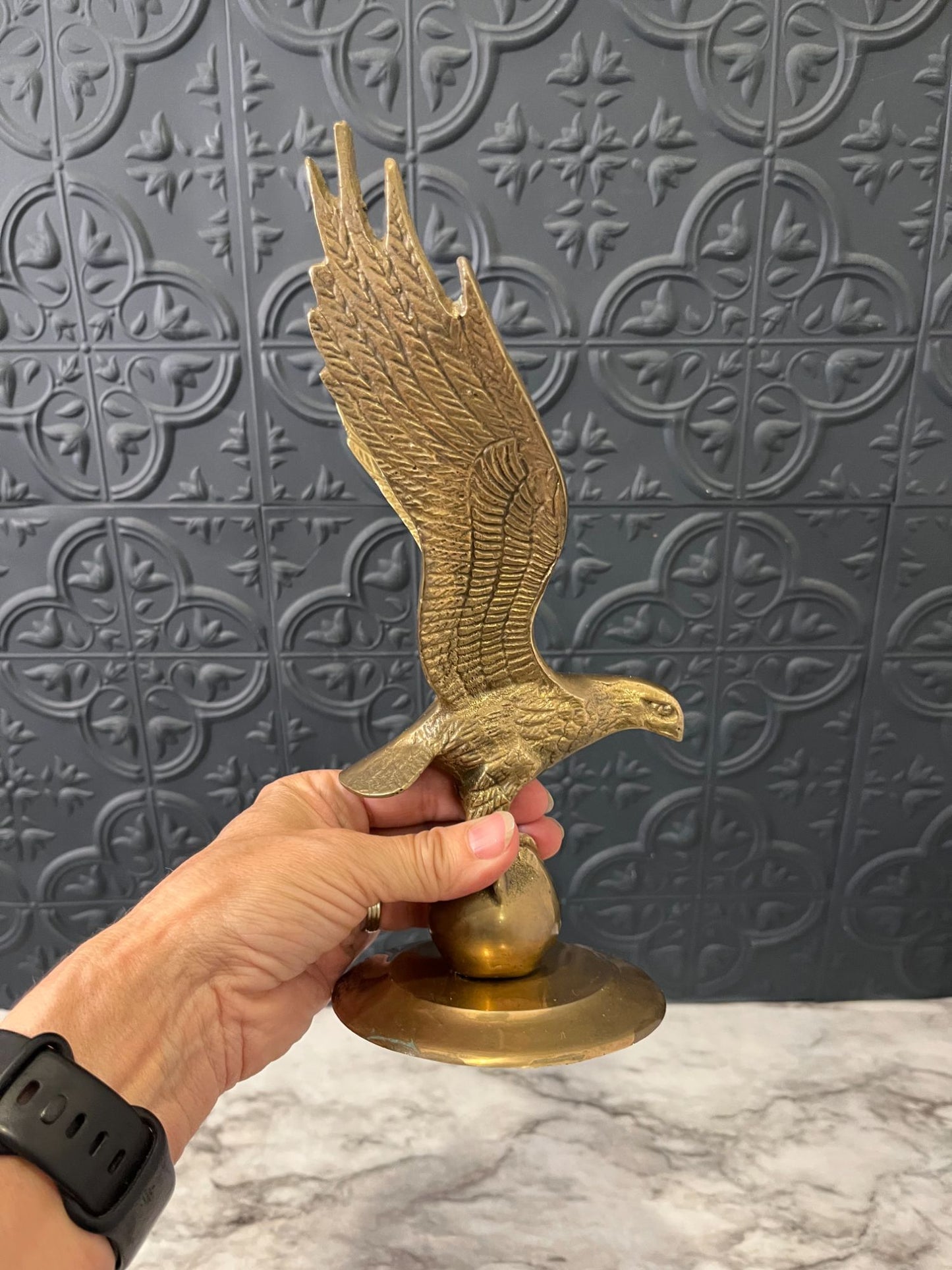 Brass eagle on ball