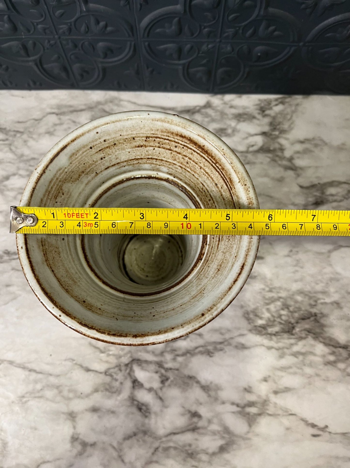 Gray/tan pottery vase wide top