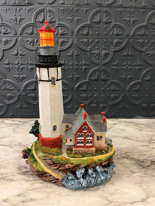 Lighthouse with red house