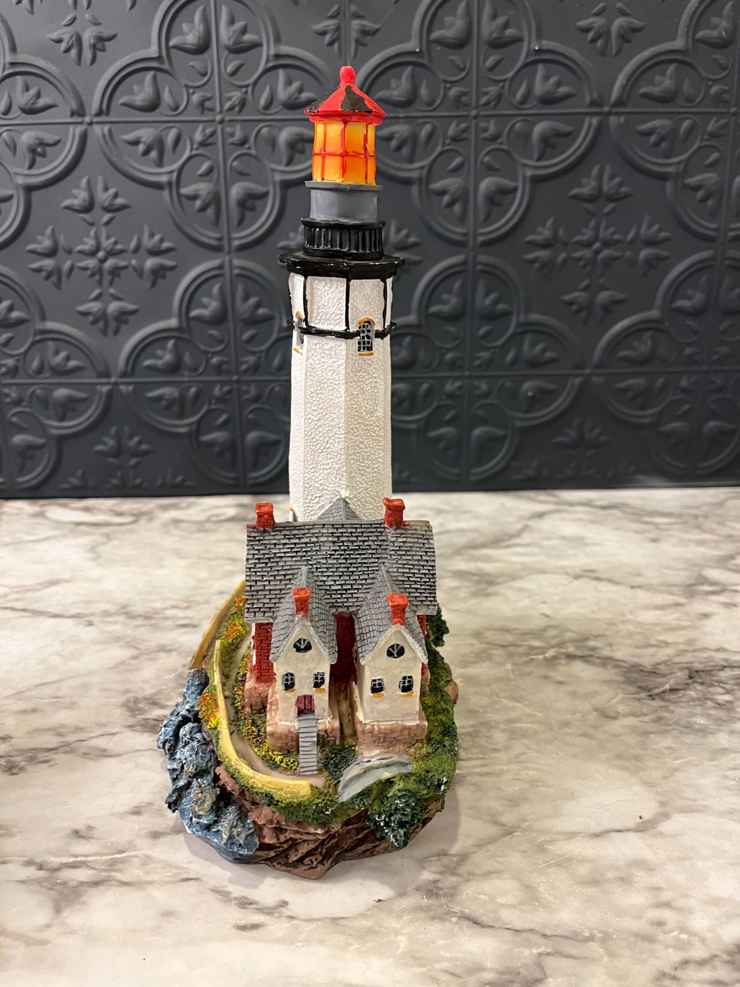 Lighthouse with red house