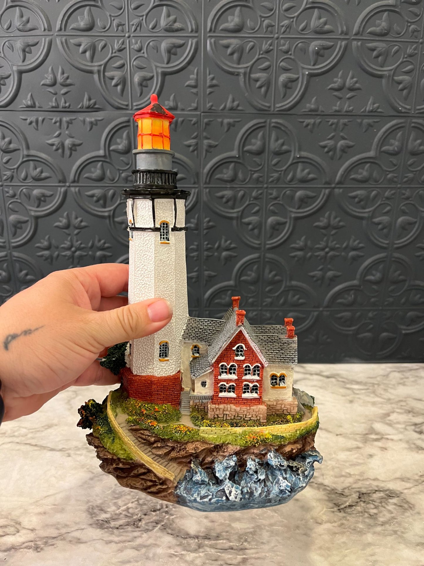 Lighthouse with red house