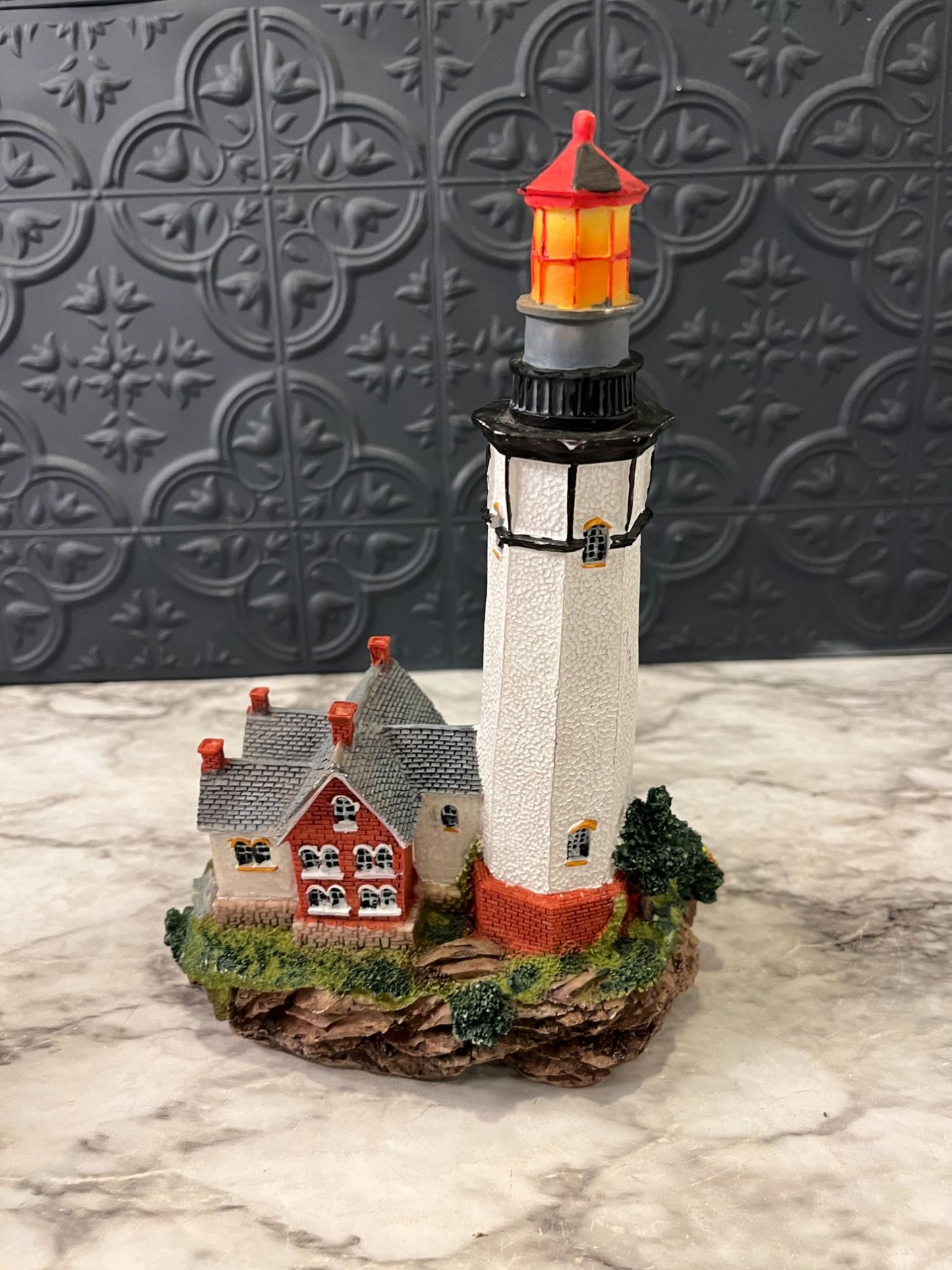 Lighthouse with red house